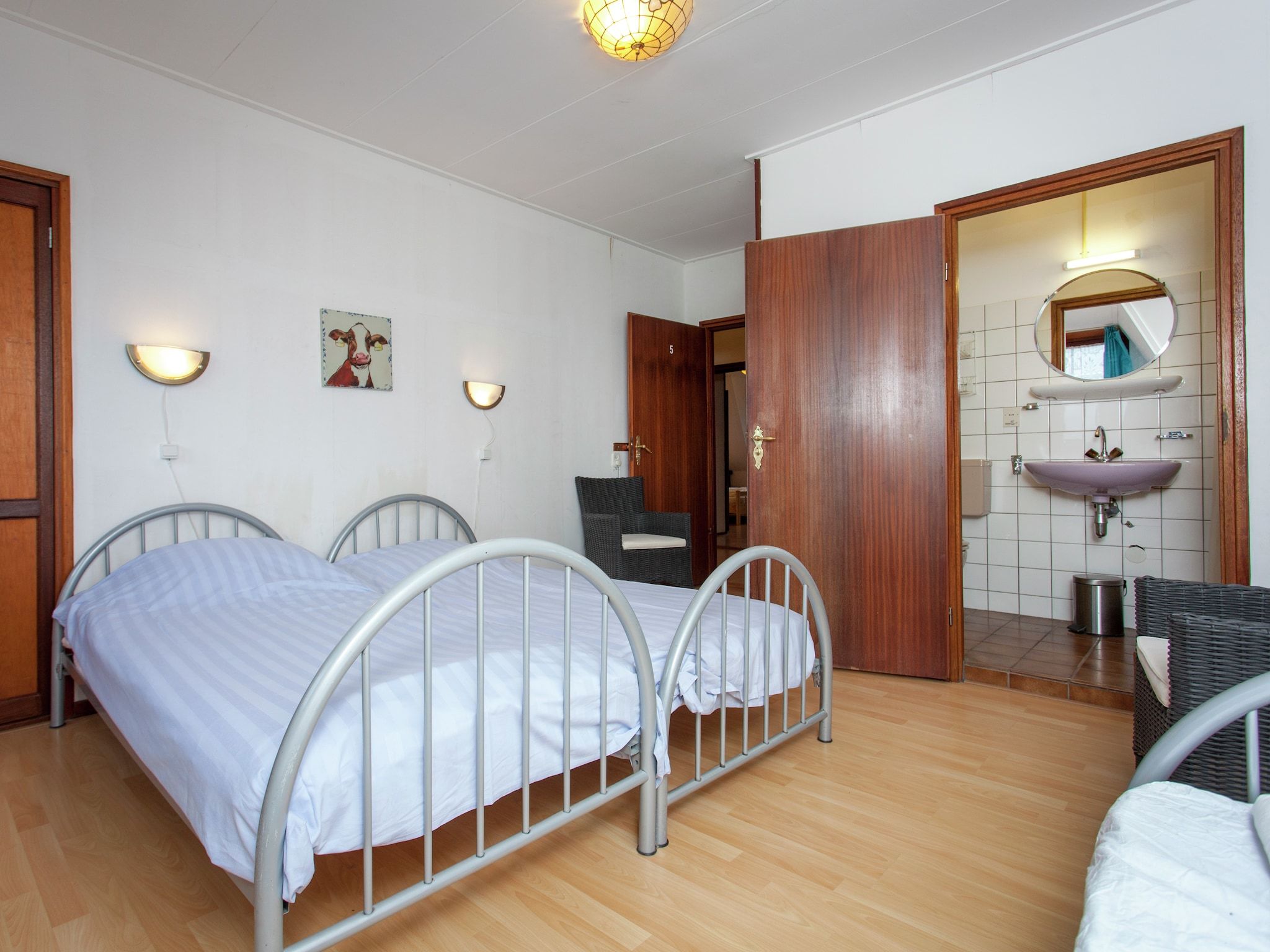 Een slaapkamer van De Vakantie boerderij in Holwerd