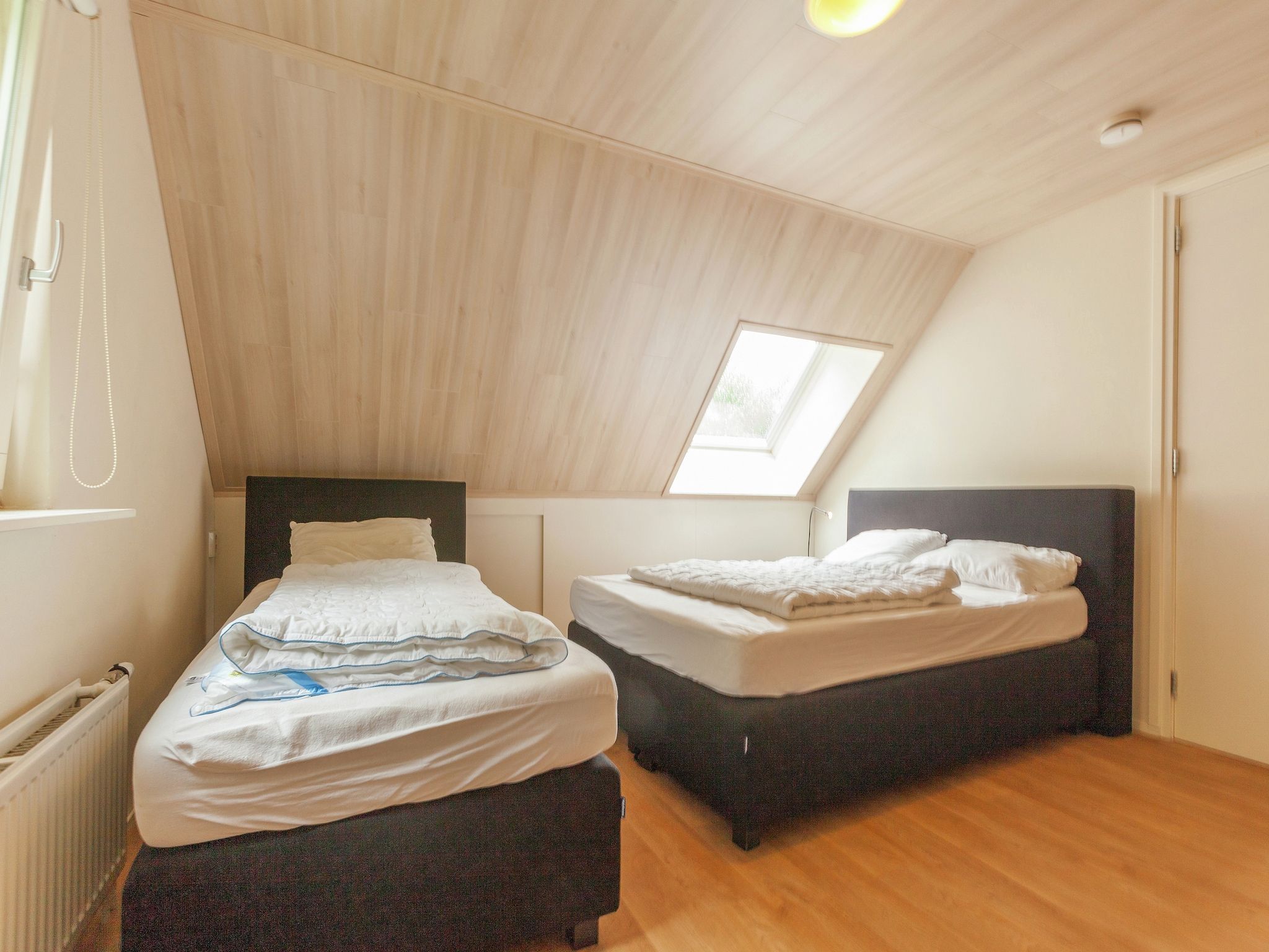 Een slaapkamer van de Lansert in Vessem