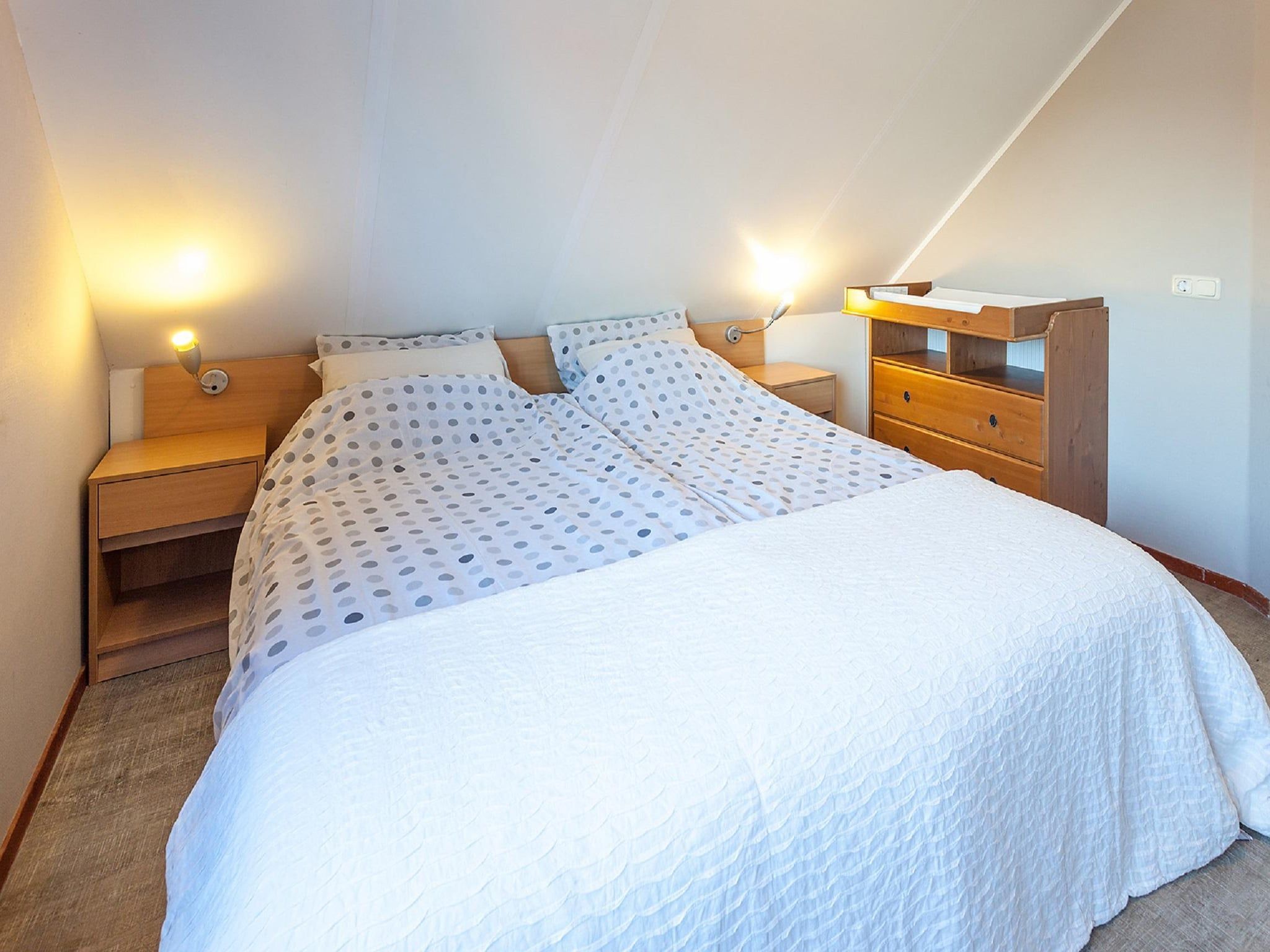 Een slaapkamer van Villavakantiepark IJsselhof 5 in Andijk