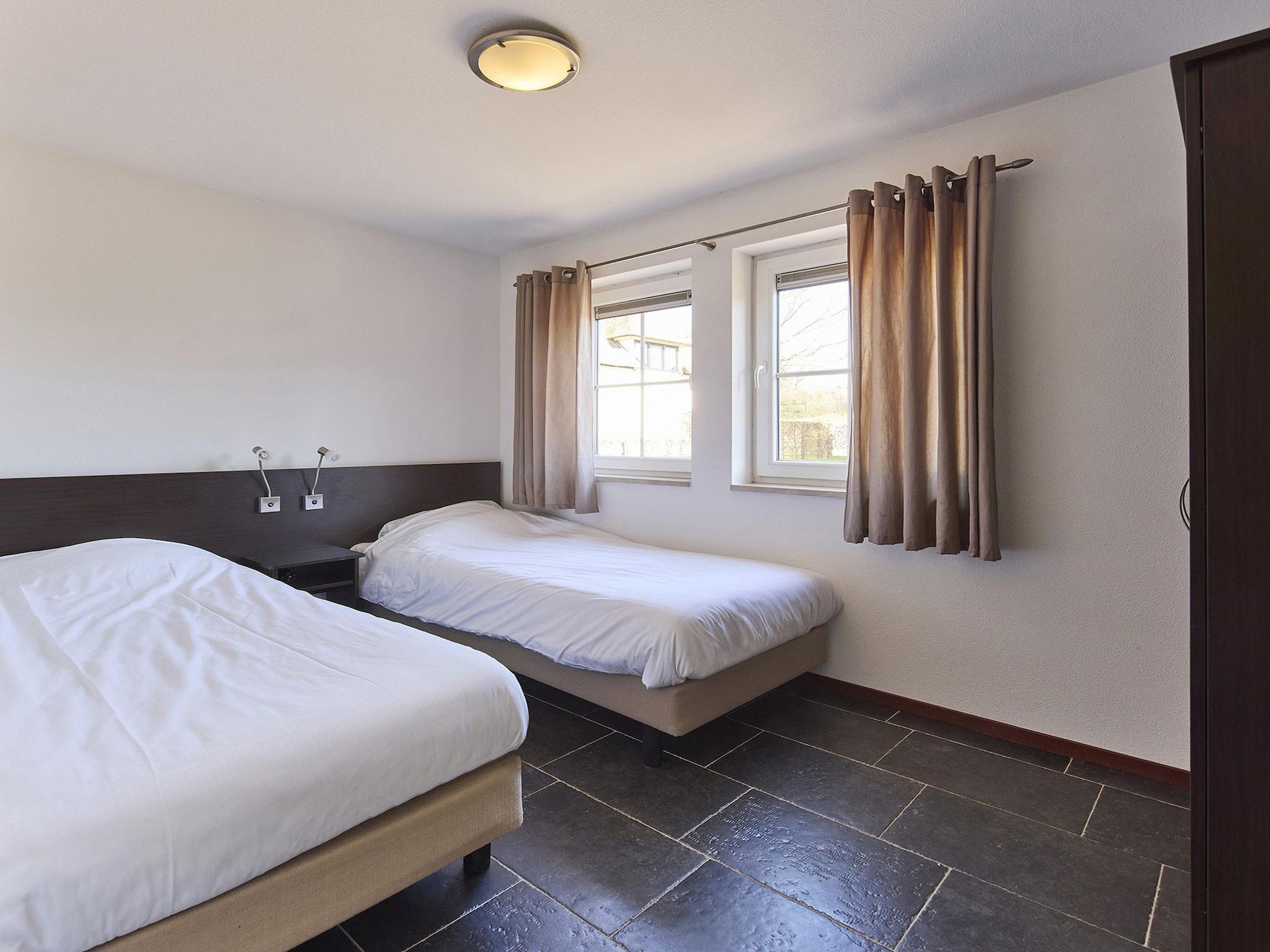 Een slaapkamer van Buitenhof De Leistert 6 in Roggel