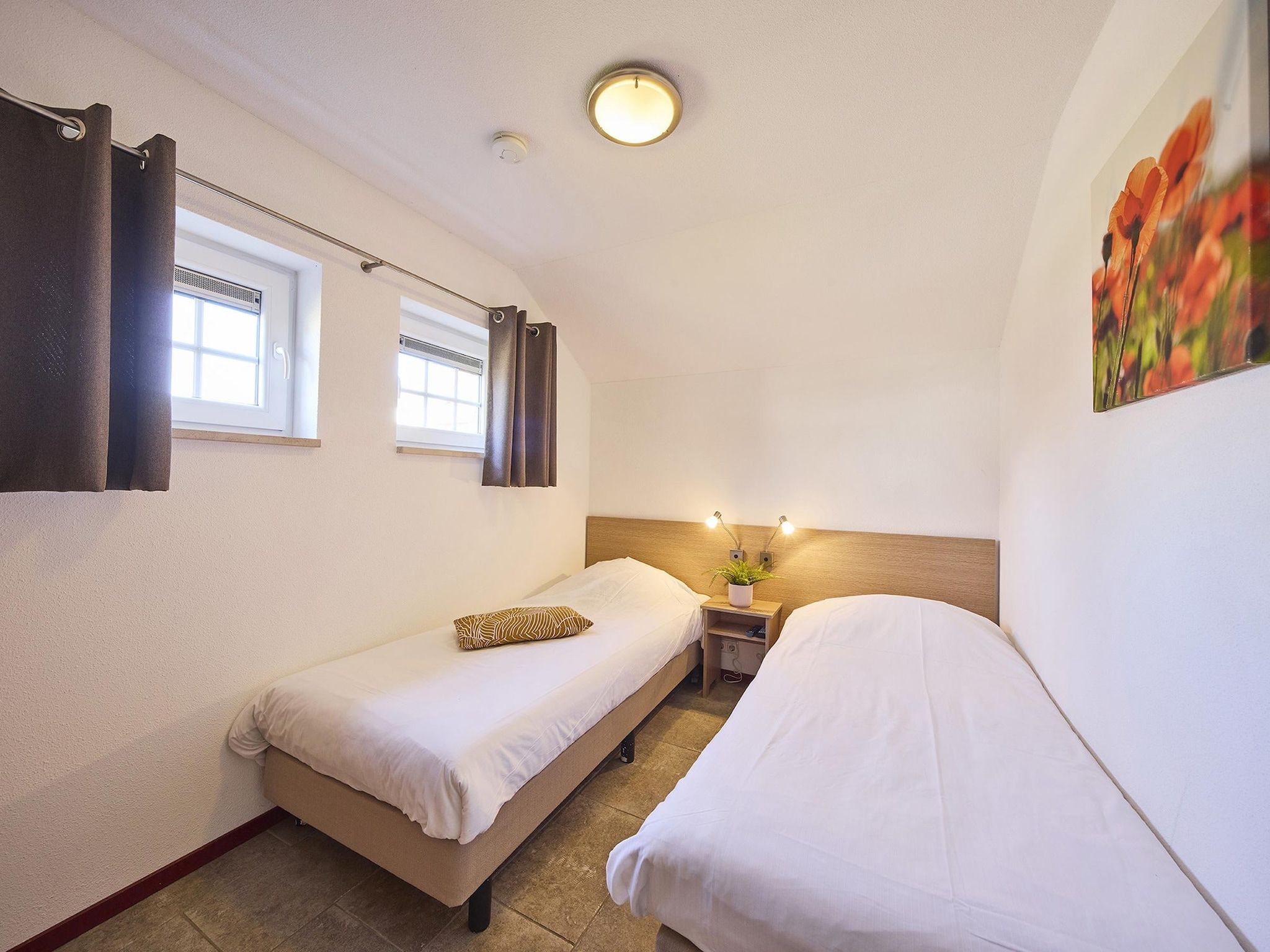 Een slaapkamer van Buitenhof De Leistert 9 in Roggel