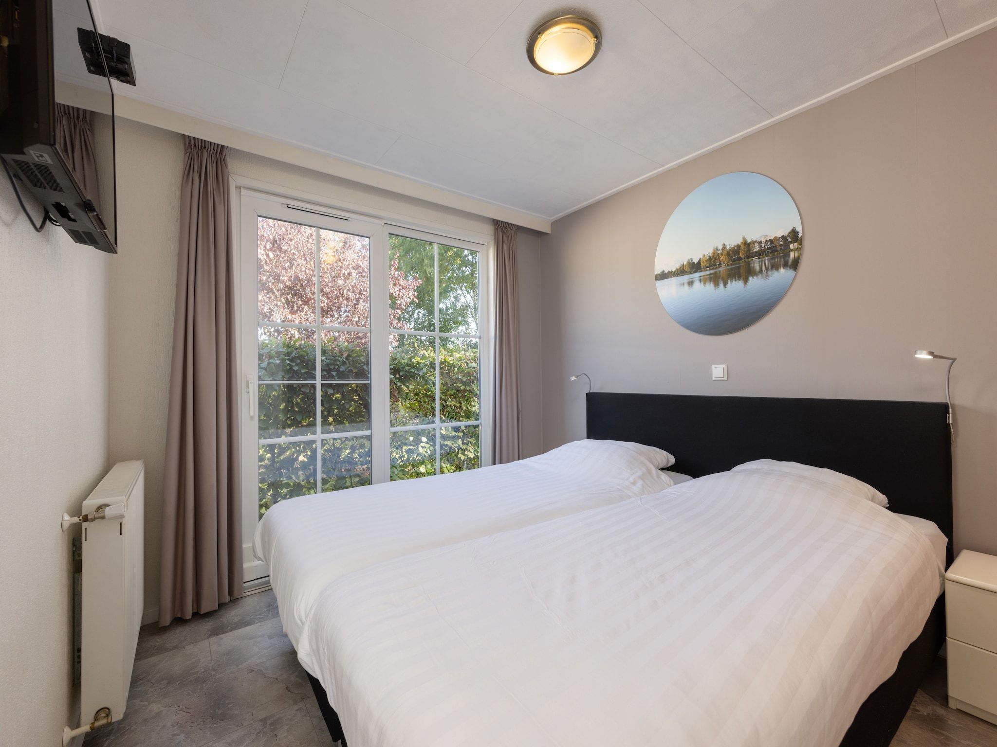 Een slaapkamer van Recreatiepark Tolplas 7 in Hoge Hexel