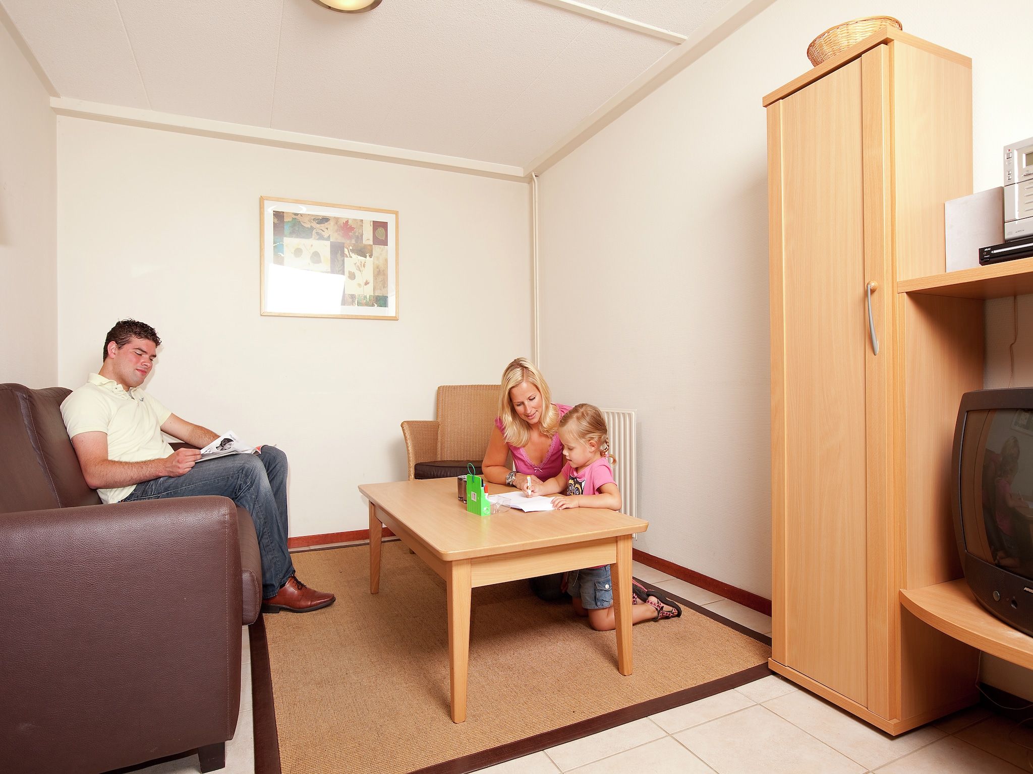 De woonkamer van Vakantiepark de Berkenhorst 5 in Kootwijk