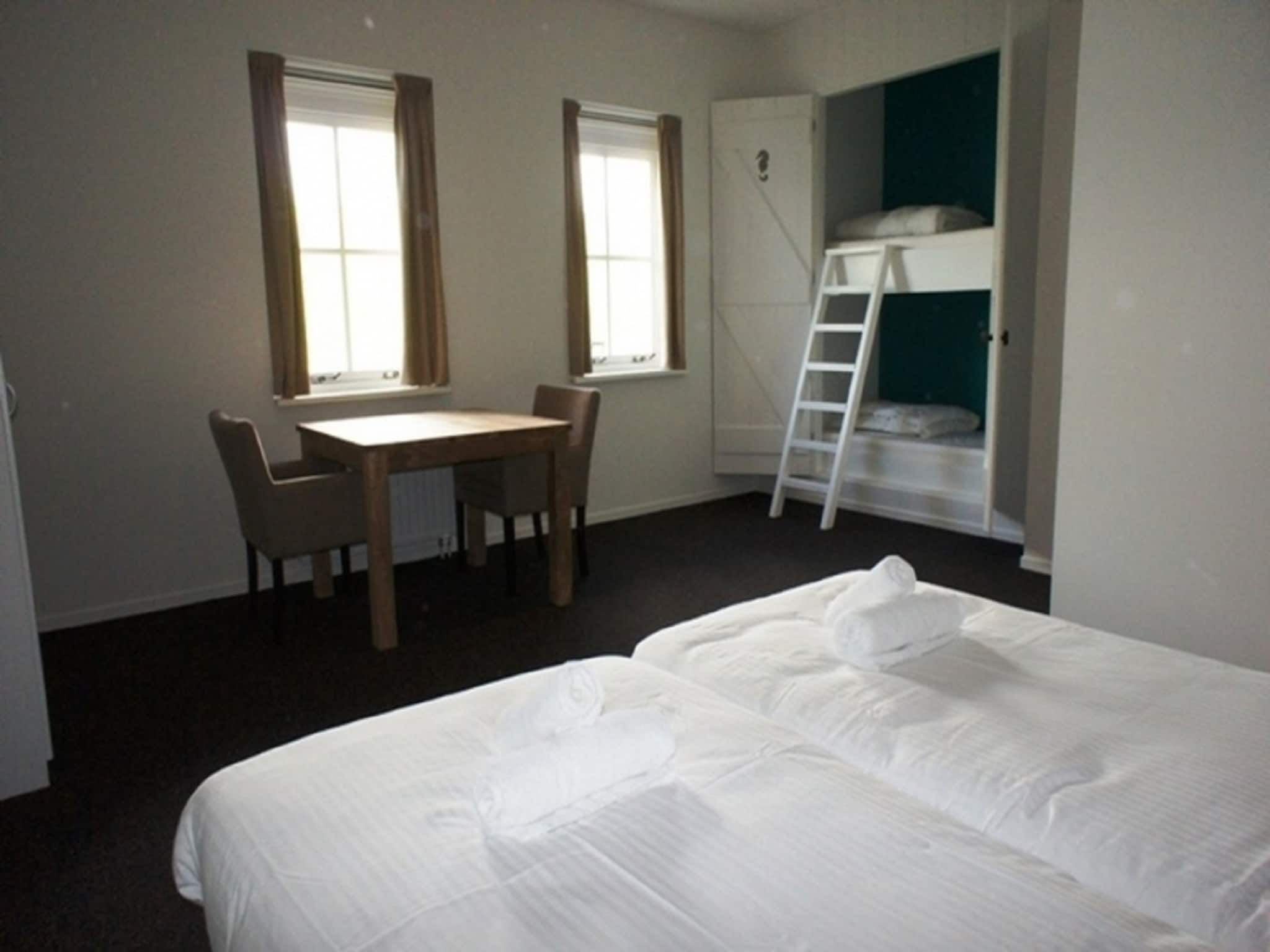 Een slaapkamer van Recreatiepark de Stelhoeve 2 in Wemeldinge