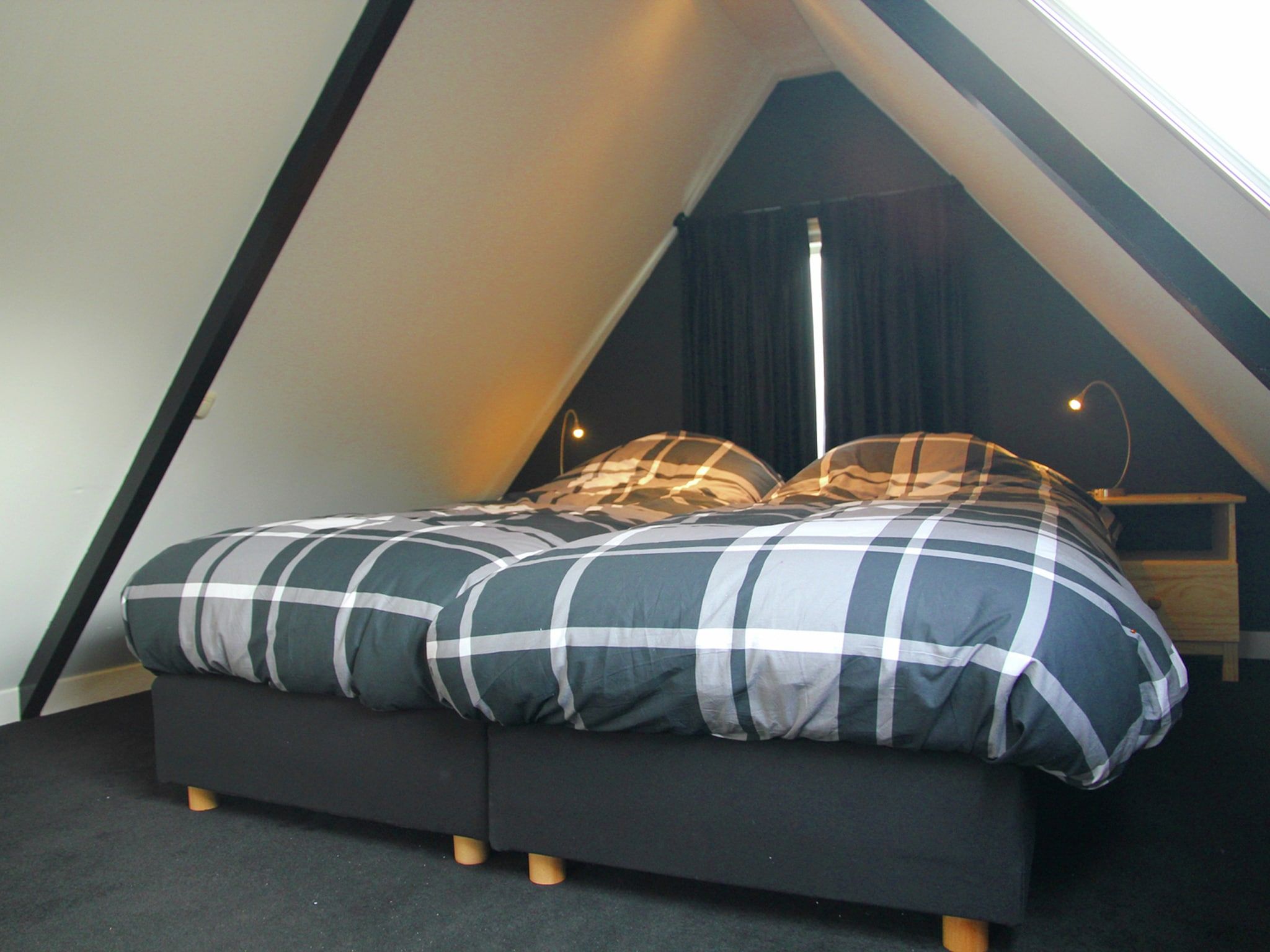 Een slaapkamer van De Ronde O in Heiloo