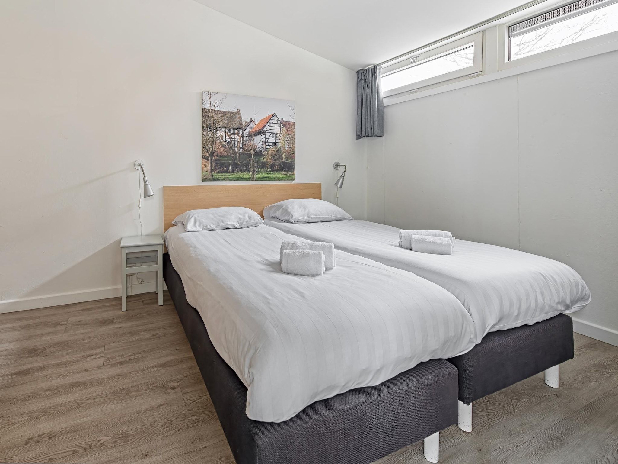Een slaapkamer van Bungalowpark Schin op Geul 3 in Walem