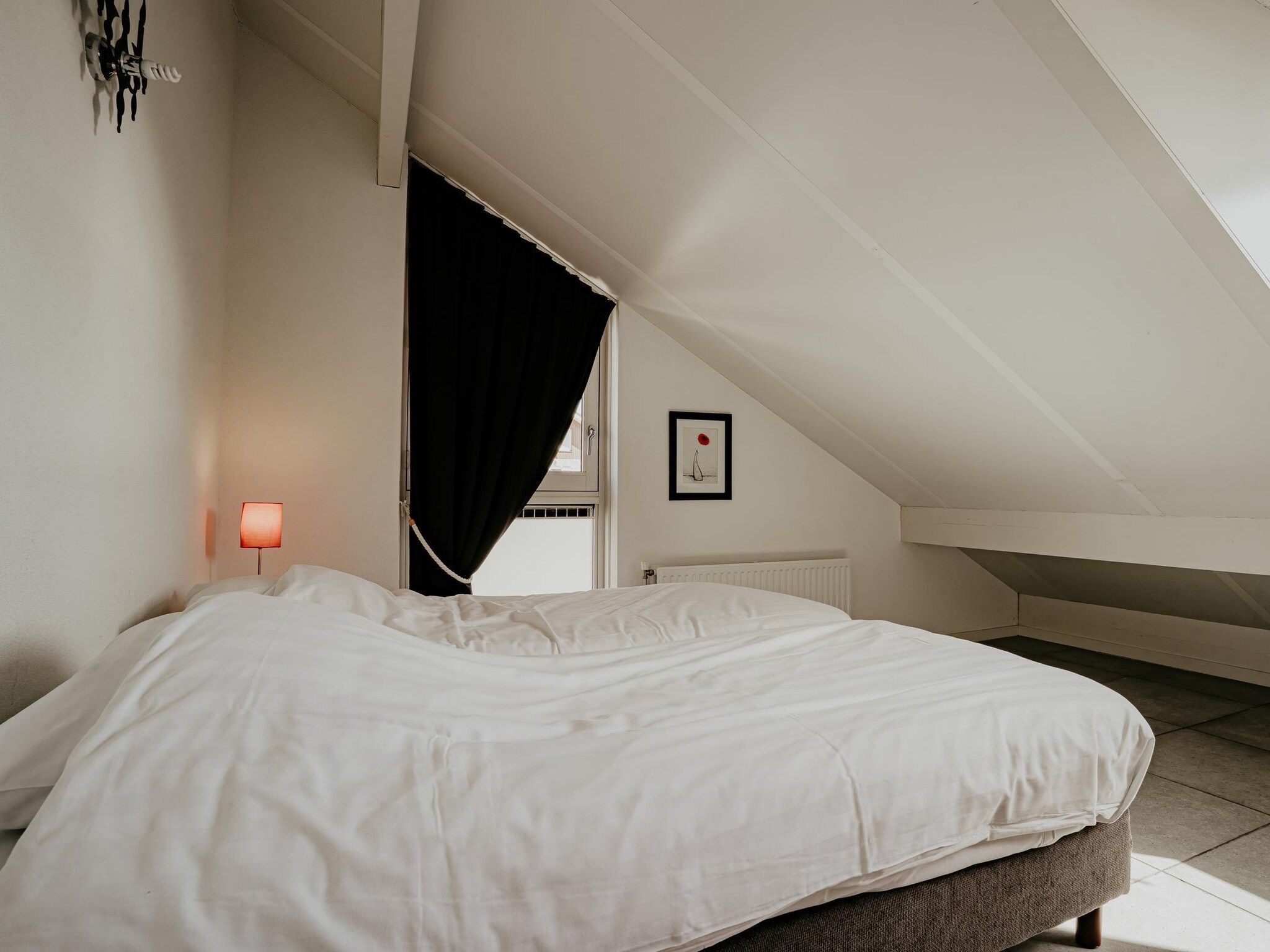 Een slaapkamer van Waterpark de Meerparel 4 in Uitgeest