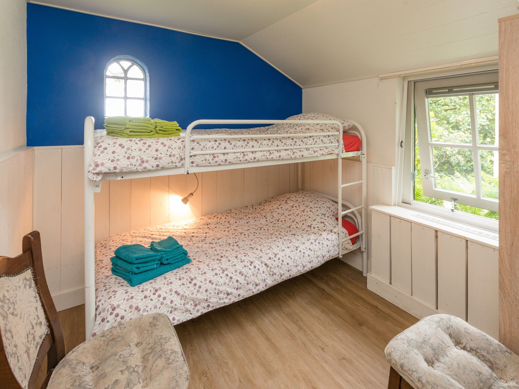 Een slaapkamer van De Merel in Den ham