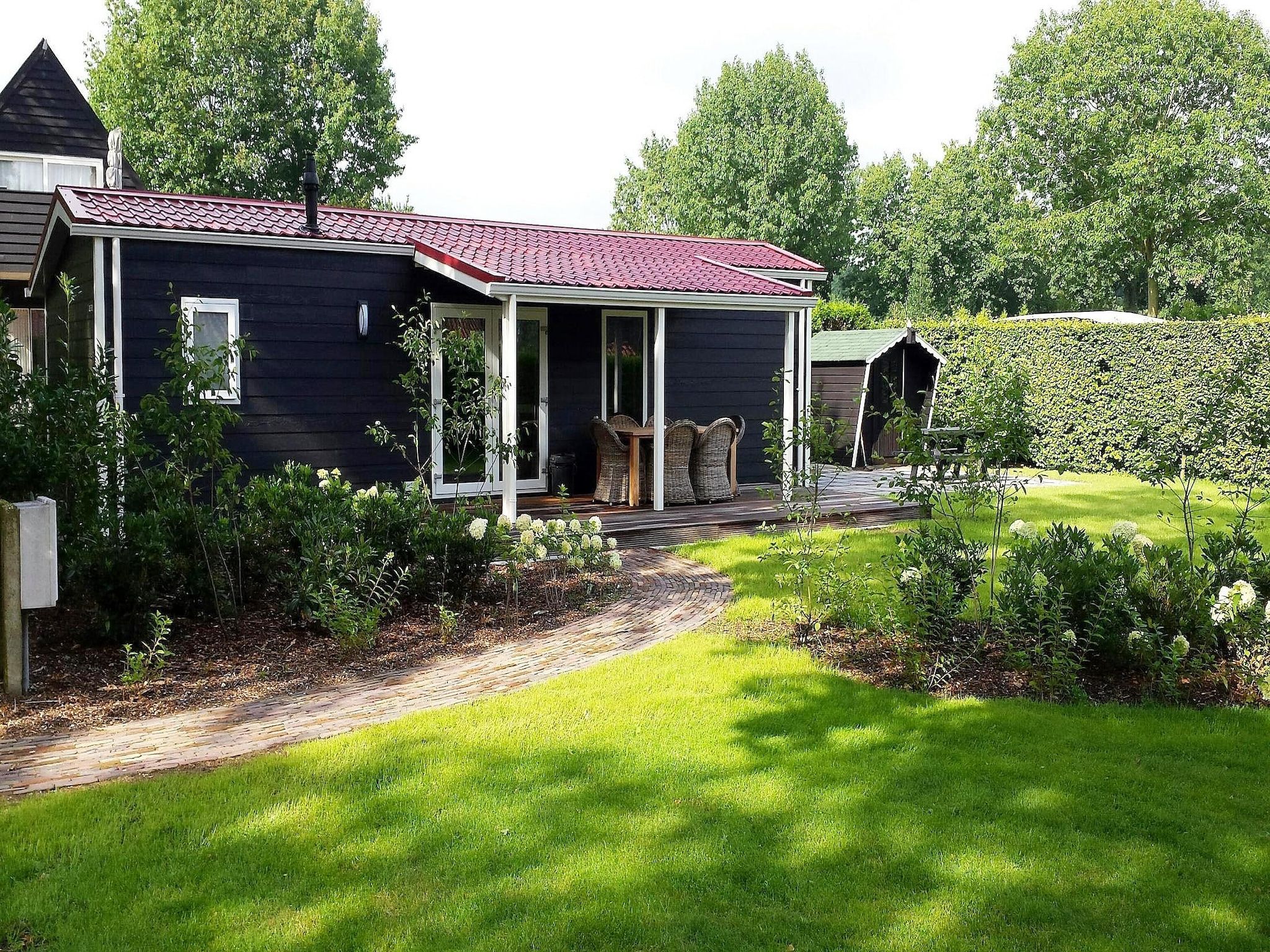 De buitenkant van Vakantiepark de Tabaksschuur 2 in Elst