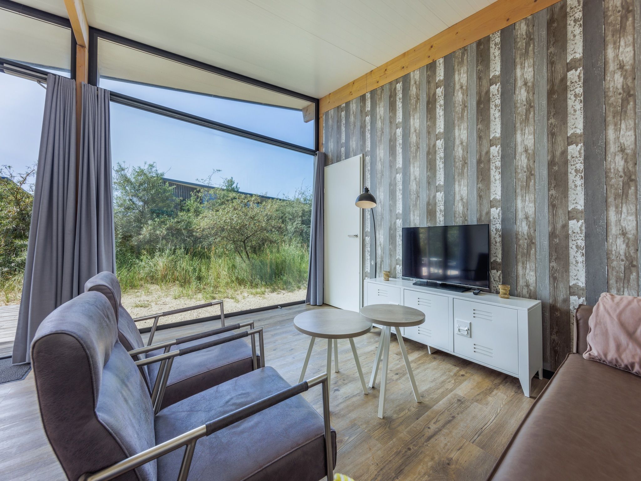 De woonkamer van Sea Lodges Bloemendaal 3 in Bloemendaal