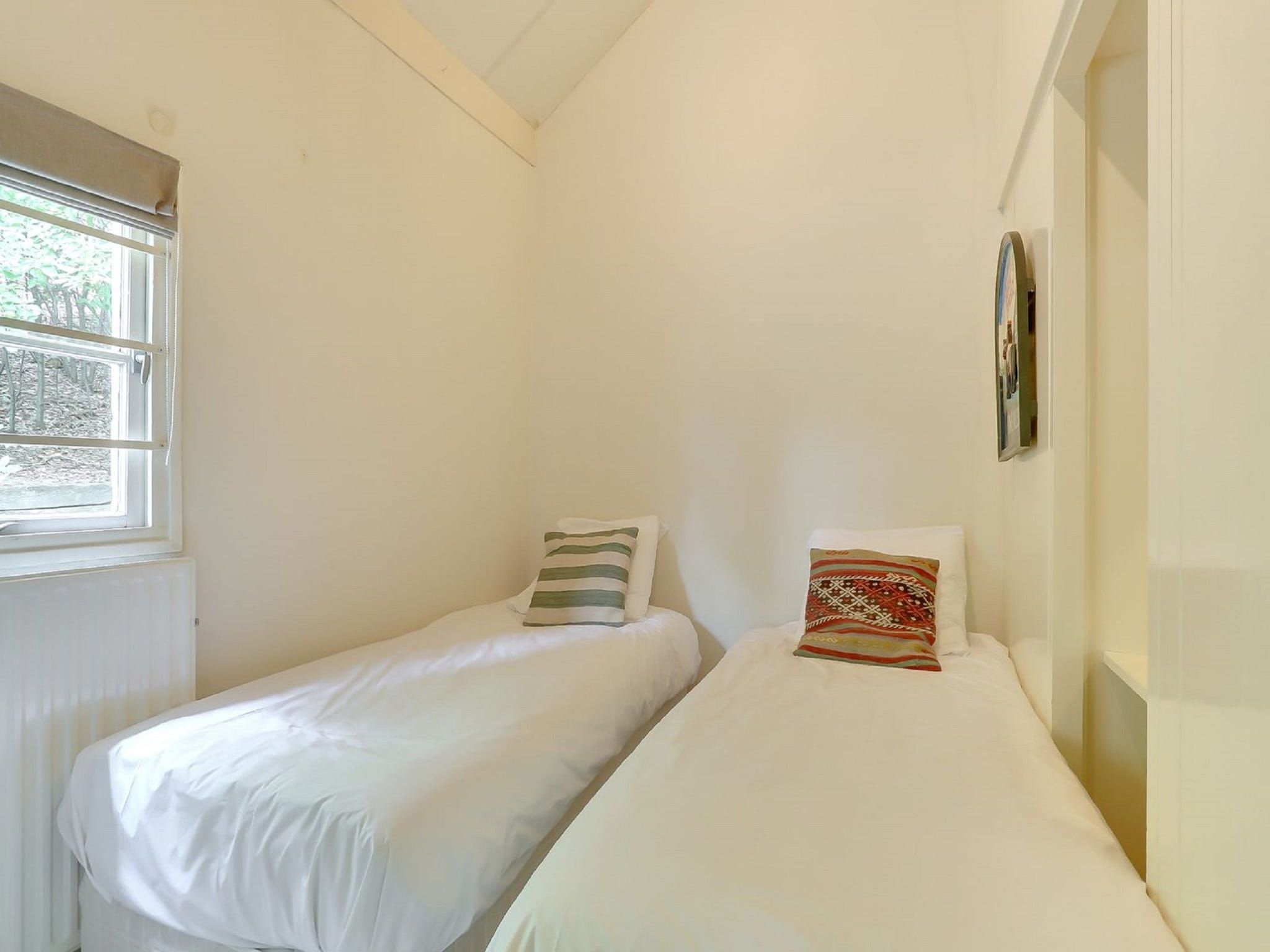 Een slaapkamer van Vakantiepark Sandberghe 3 in Uden