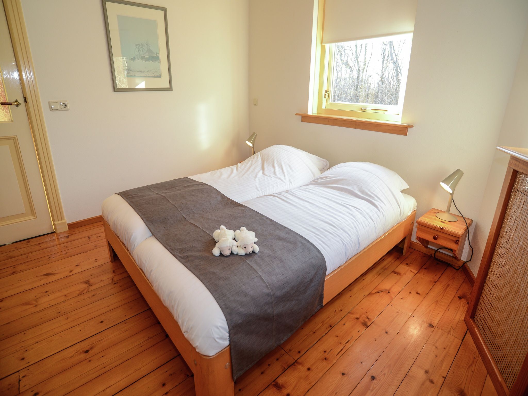 Een slaapkamer van De Kerkuil in De Cocksdorp-Texel