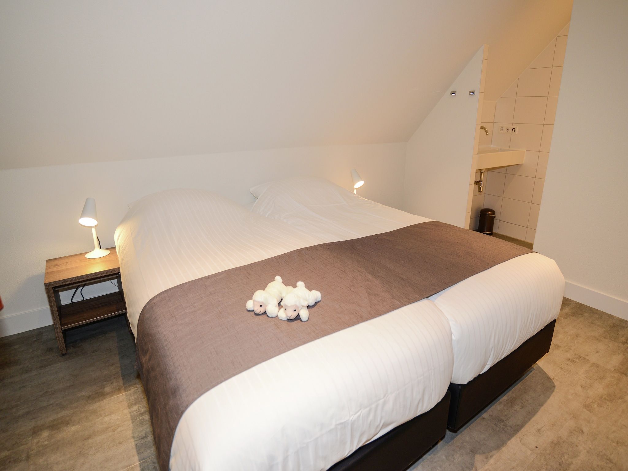 Een slaapkamer van Villa  Hoogelandt 10 in De Koog Texel