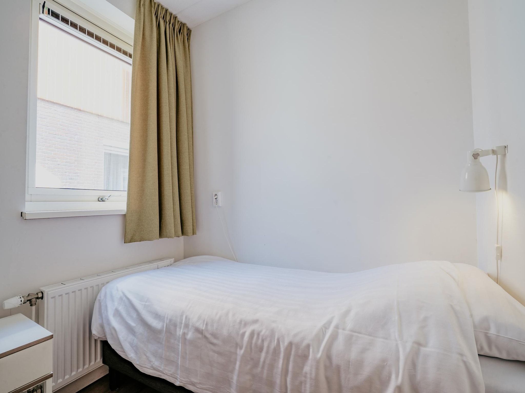 Een slaapkamer van Waterpark de Meerparel 8 in Uitgeest