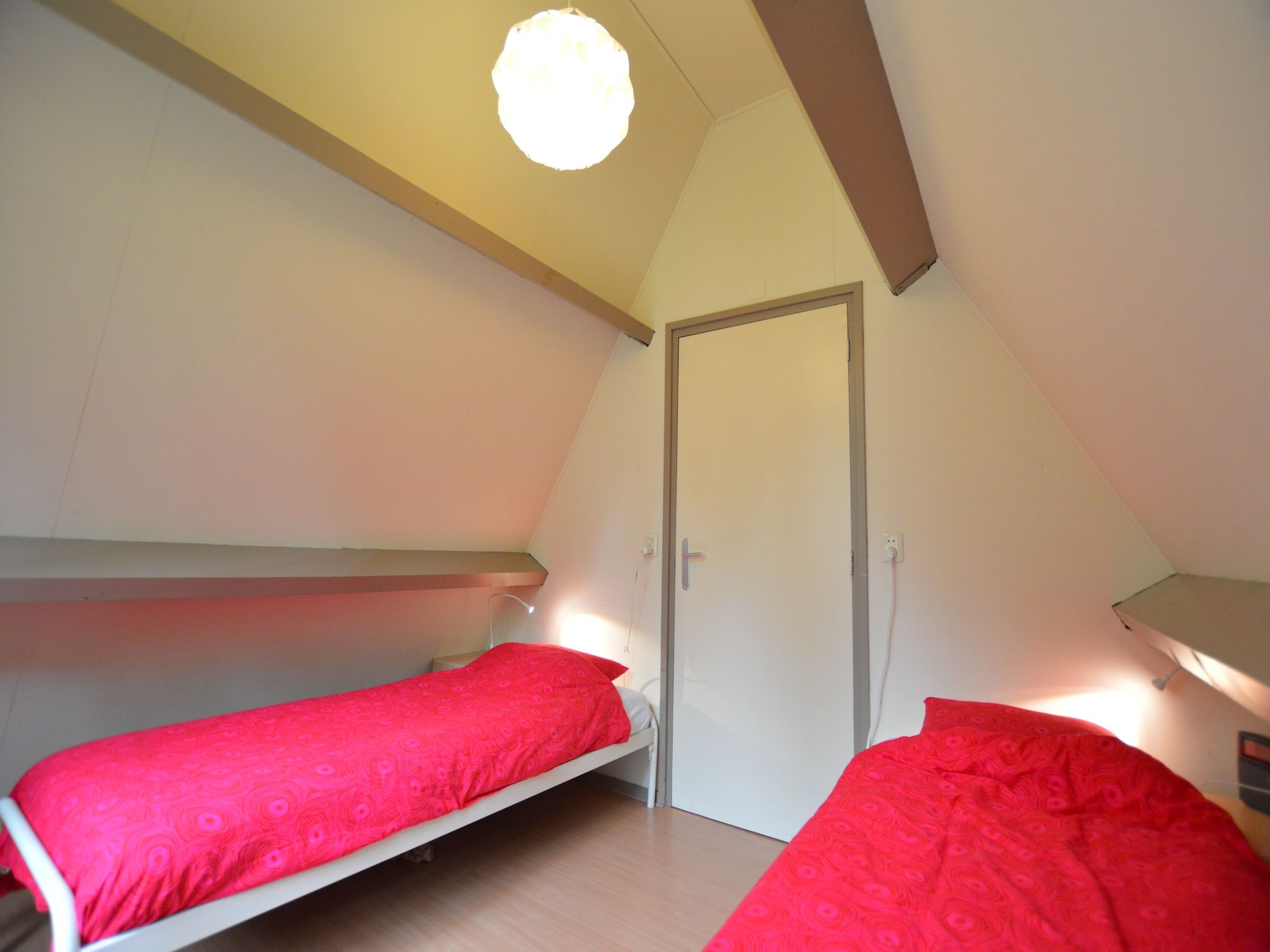 Een slaapkamer van Bungalow 87 in Stramproy