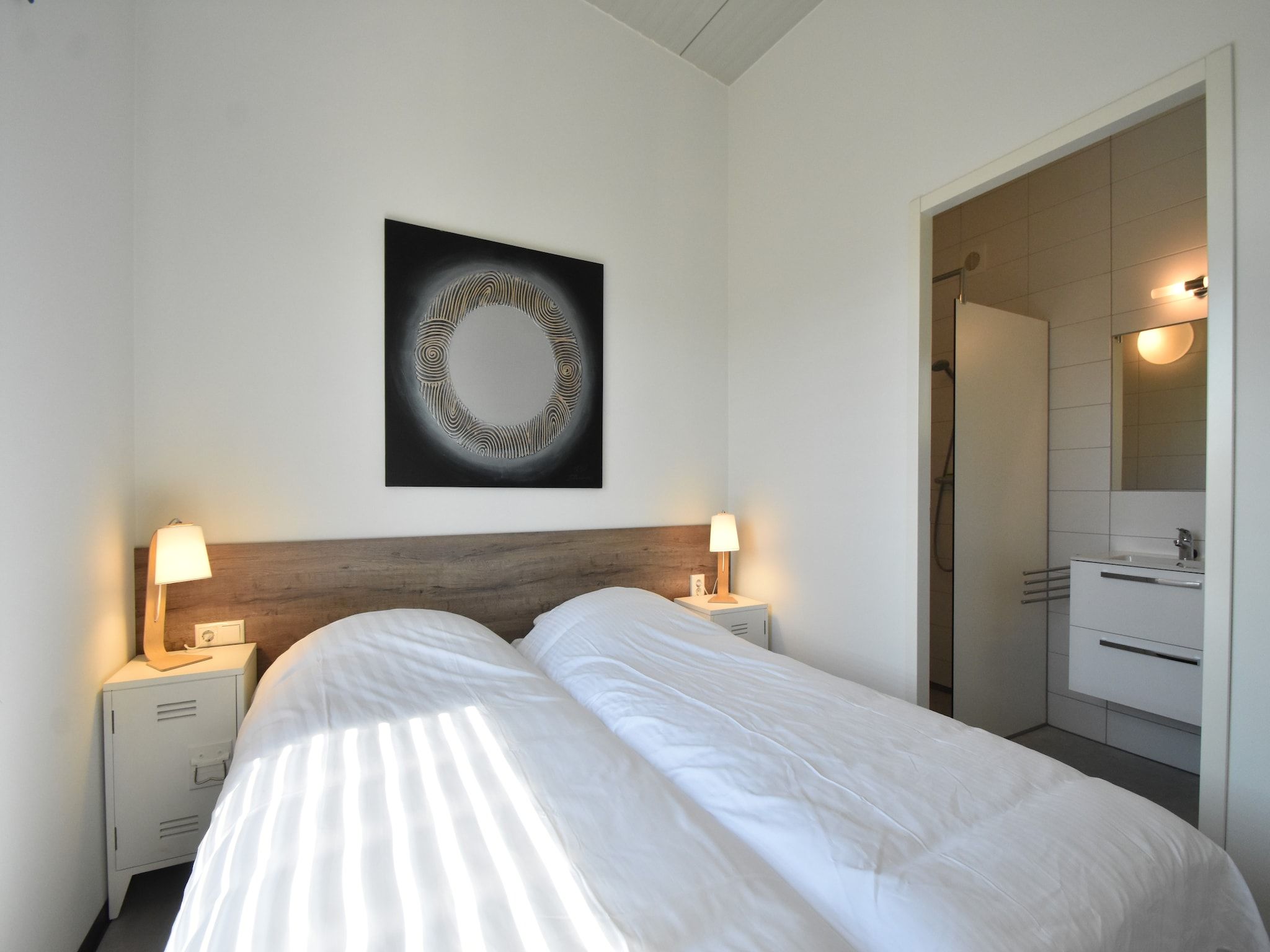 Een slaapkamer van Quality Lodge aan de Duinen in Callantsoog