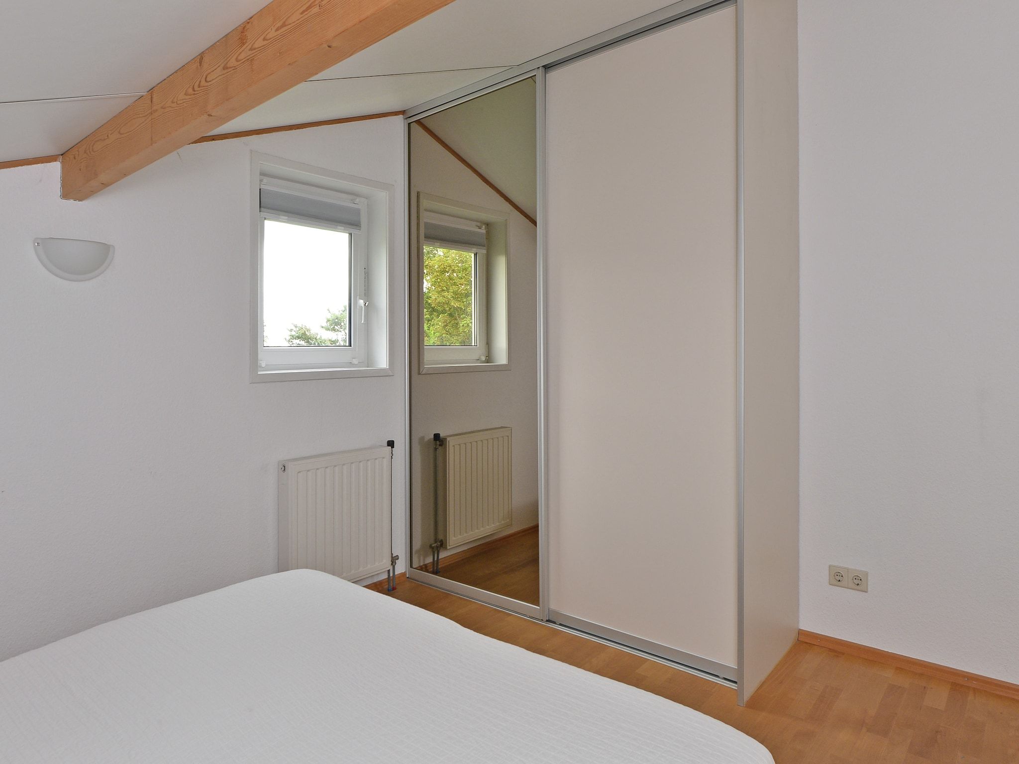 Een slaapkamer van Cederlaan 8 in Kamperland