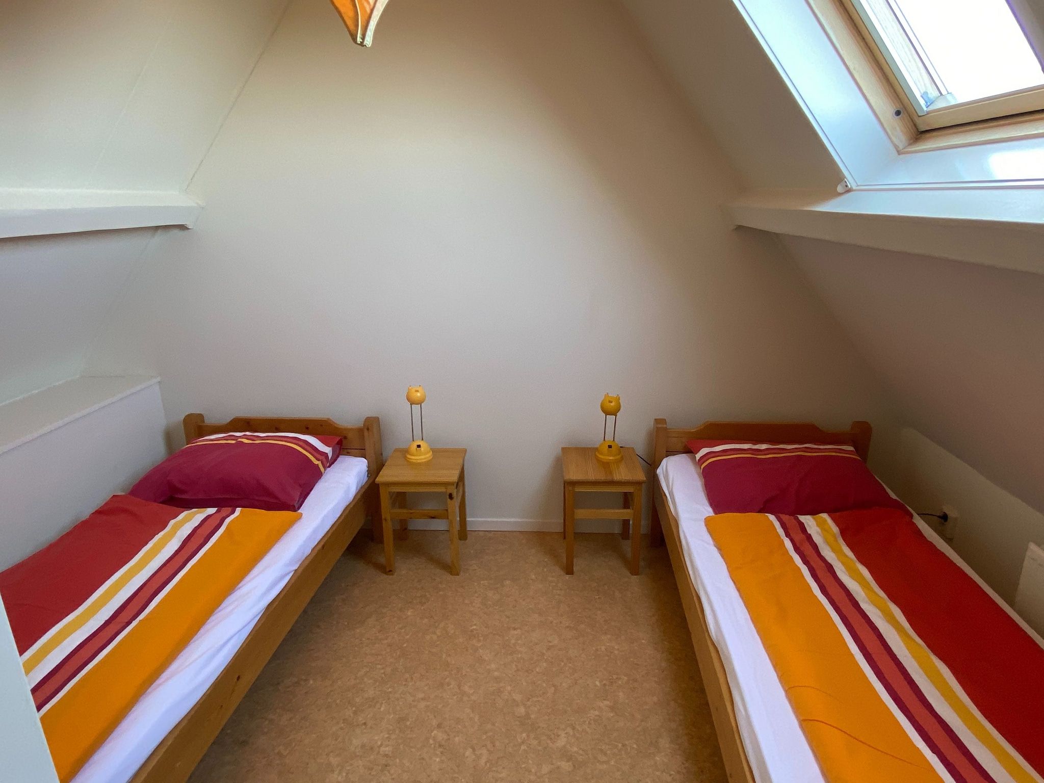 Een slaapkamer van Huize Glory Tijgeroog in Bergen aan Zee