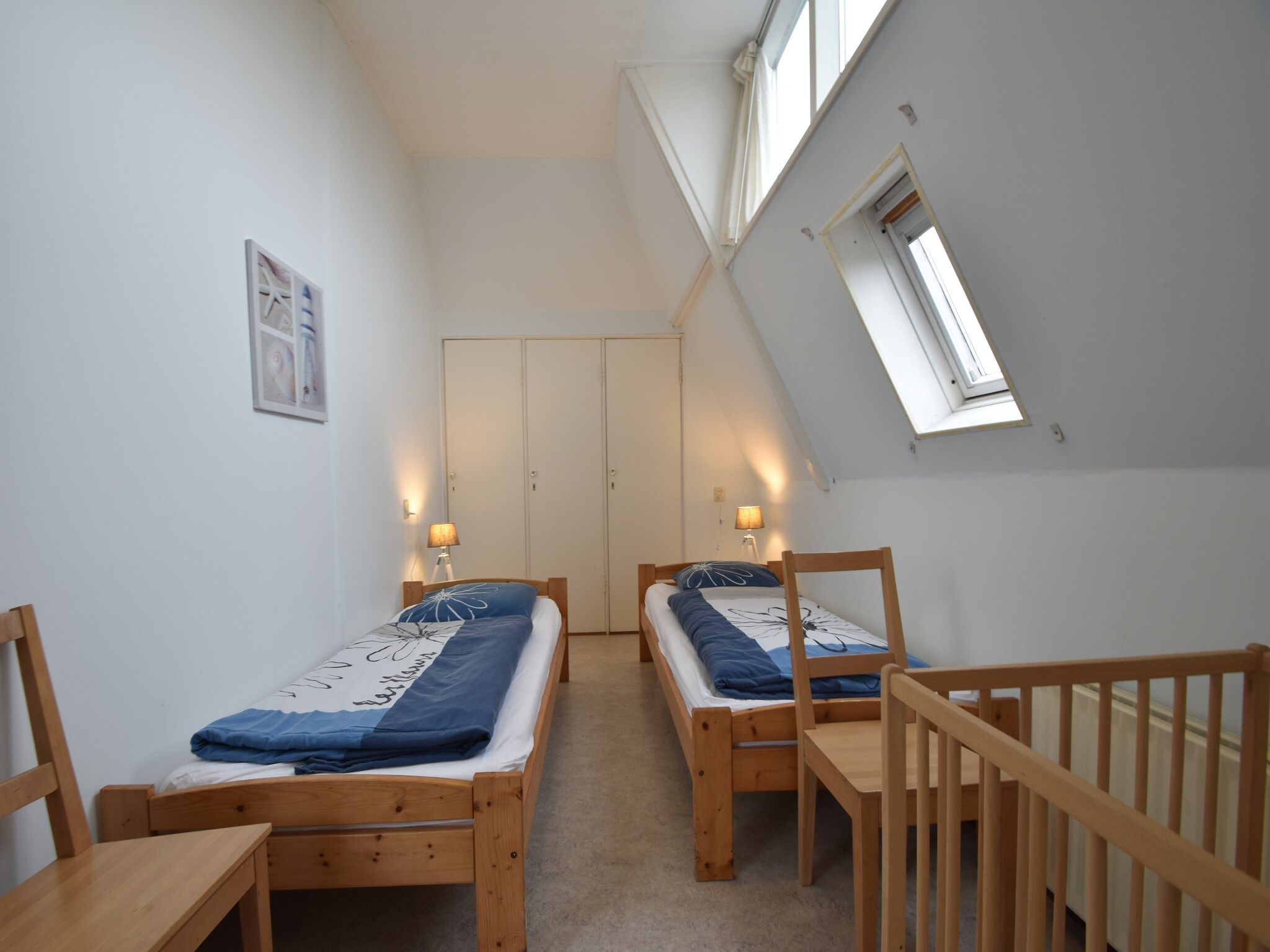 Een slaapkamer van Huize Glory Jade in Bergen aan zee