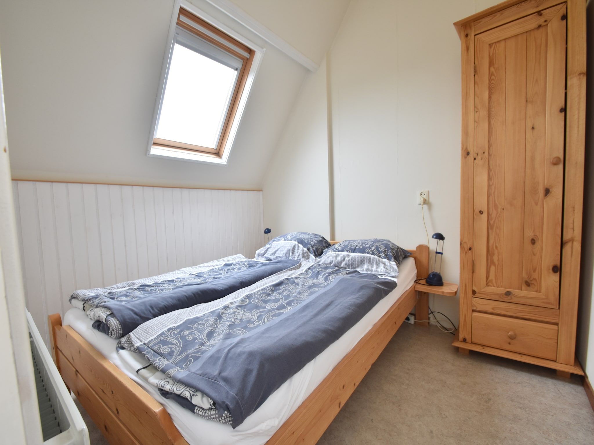 Een slaapkamer van Huize Glory Jade in Bergen aan zee