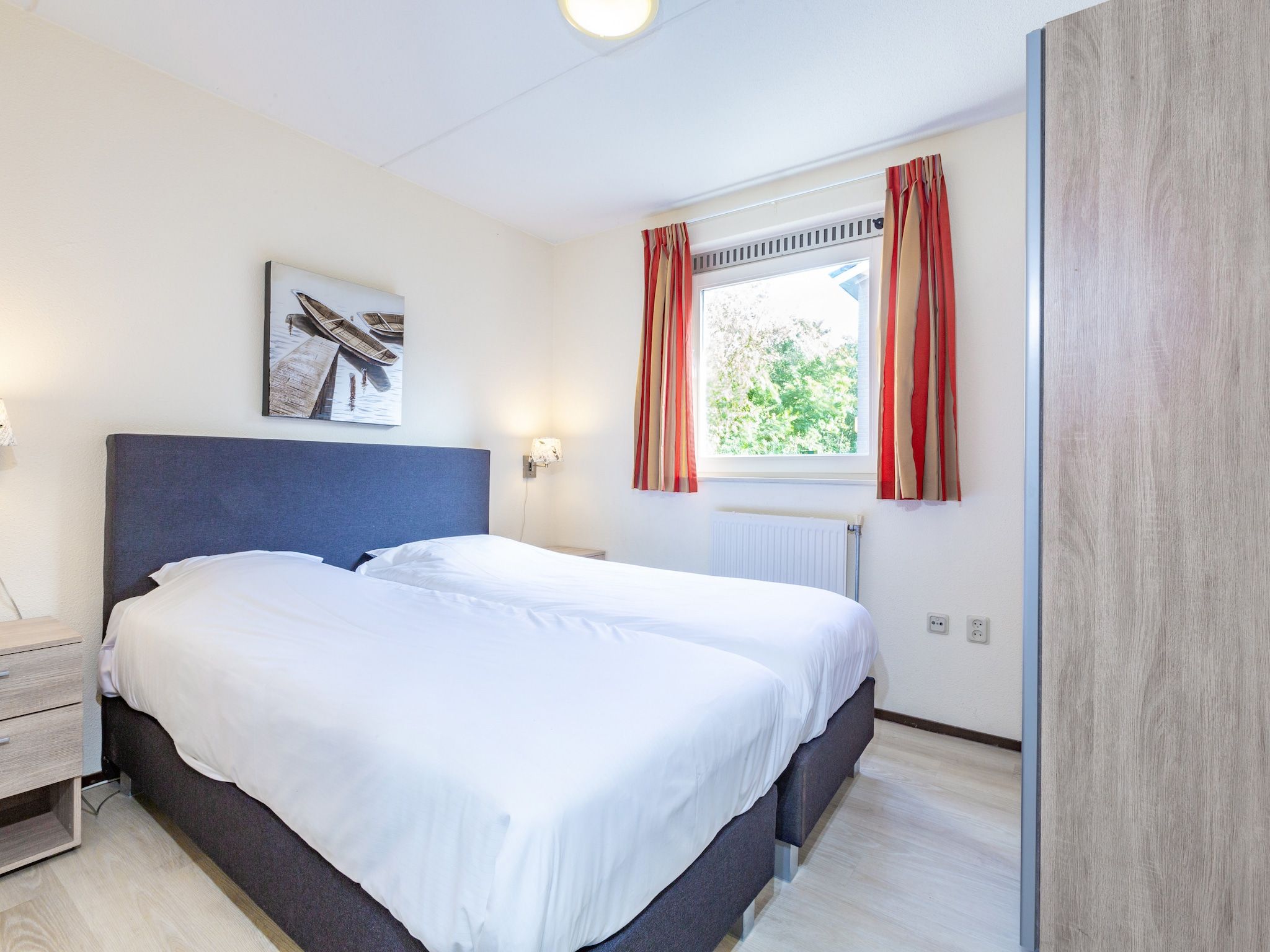 Een slaapkamer van Vakantiepark Kijkduin 7 in Den Haag