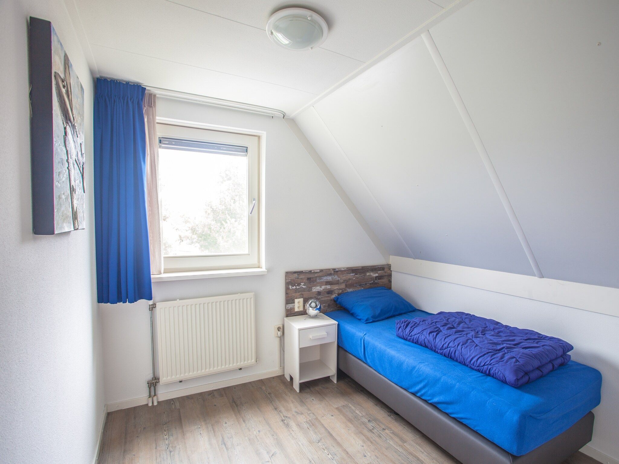 Een slaapkamer van Oosterdijk 6 in Medemblik