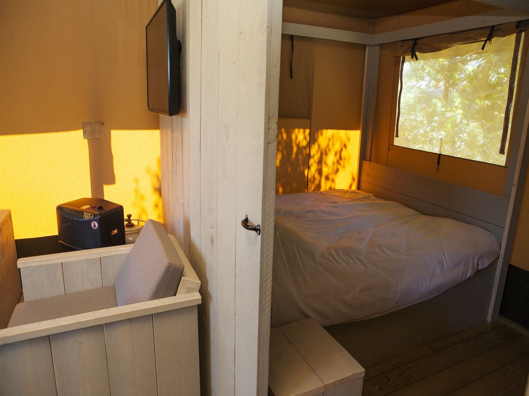 Een slaapkamer van Recreatiepark de Boshoek 19 in Voorthuizen