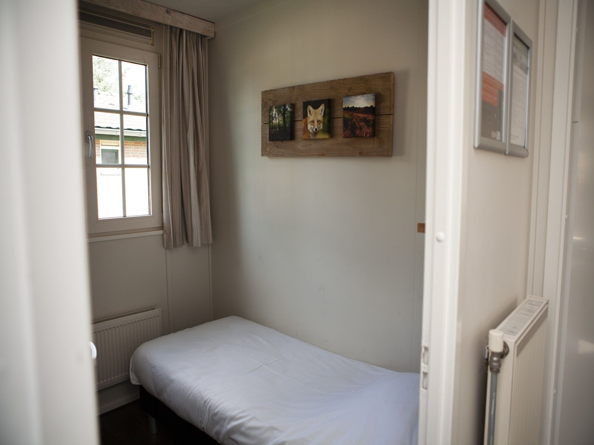 Een slaapkamer van Recreatiepark de Boshoek 10 in Voorthuizen