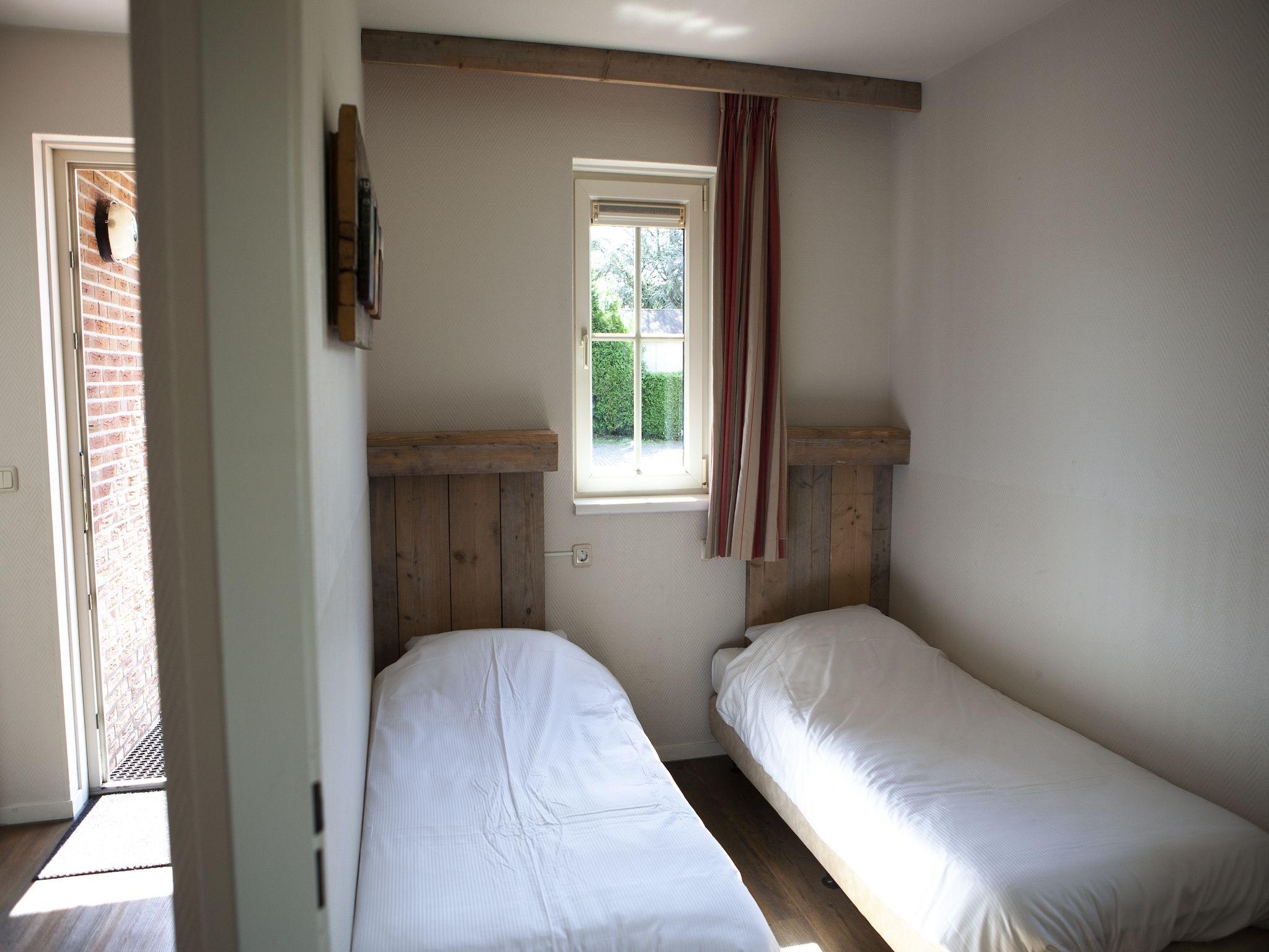 Een slaapkamer van Recreatiepark de Boshoek 12 in Voorthuizen