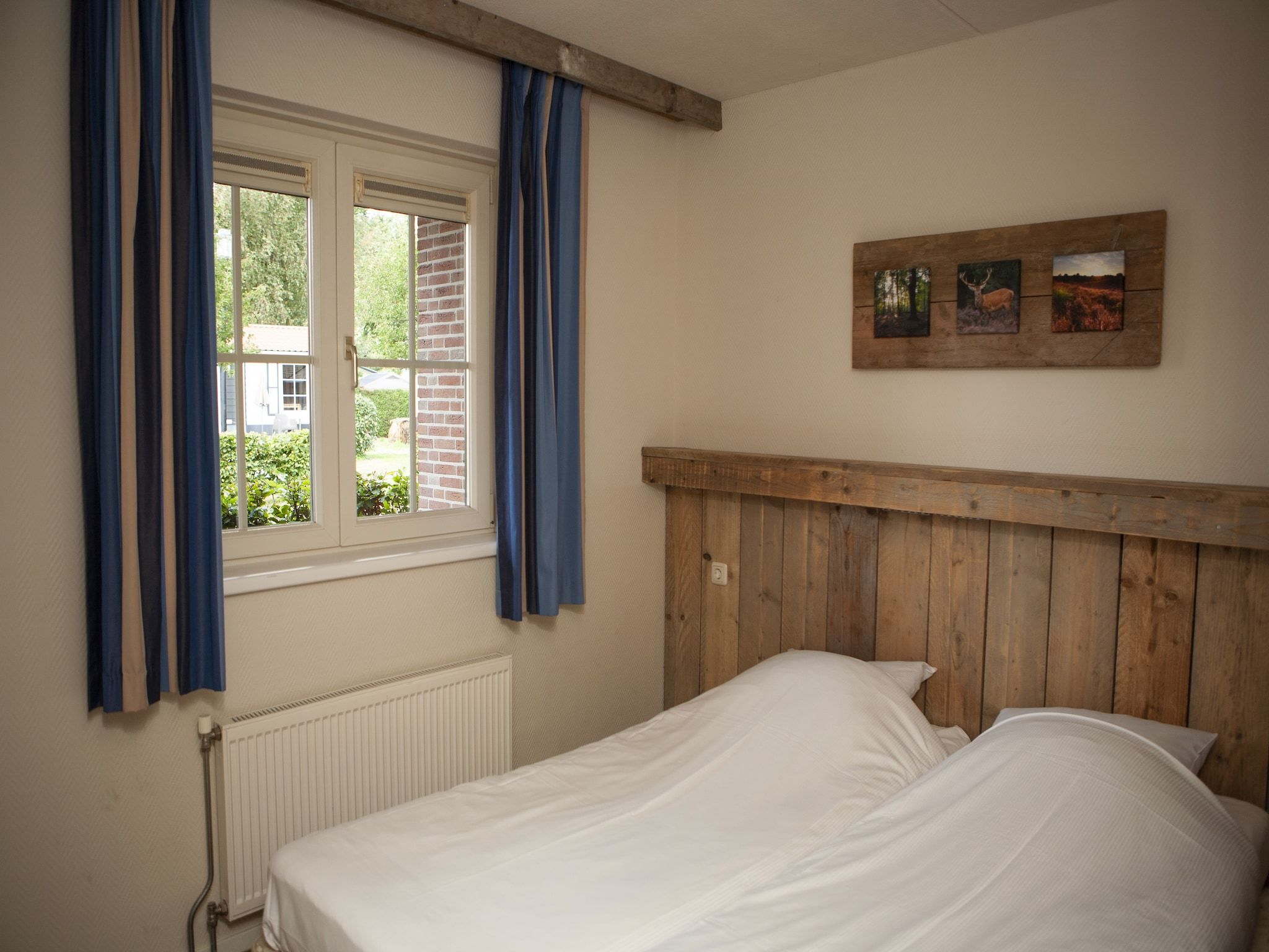 Een slaapkamer van Recreatiepark de Boshoek 14 in Voorthuizen