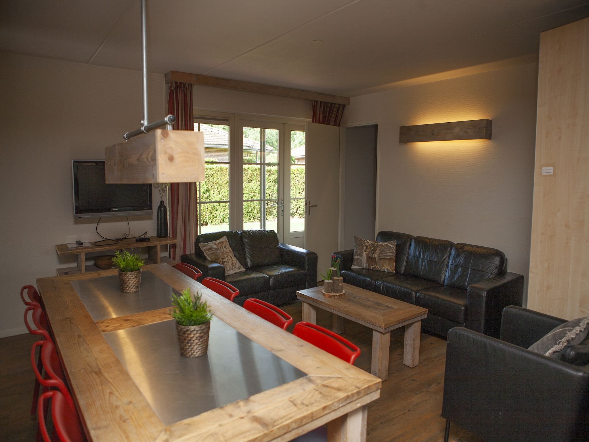 De woonkamer van Recreatiepark de Boshoek 15 in Voorthuizen