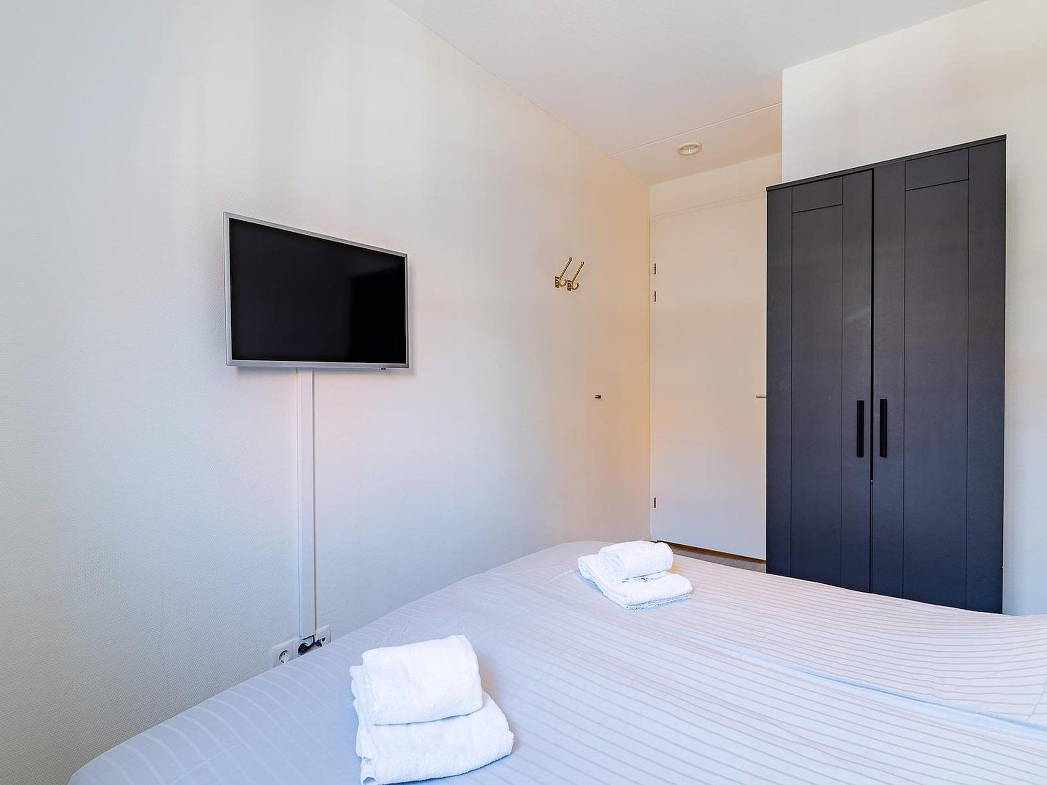 Een slaapkamer van appartement Kaapduinseweg 13 Dishoek 13D luxe 6p sauna in Koudekerke