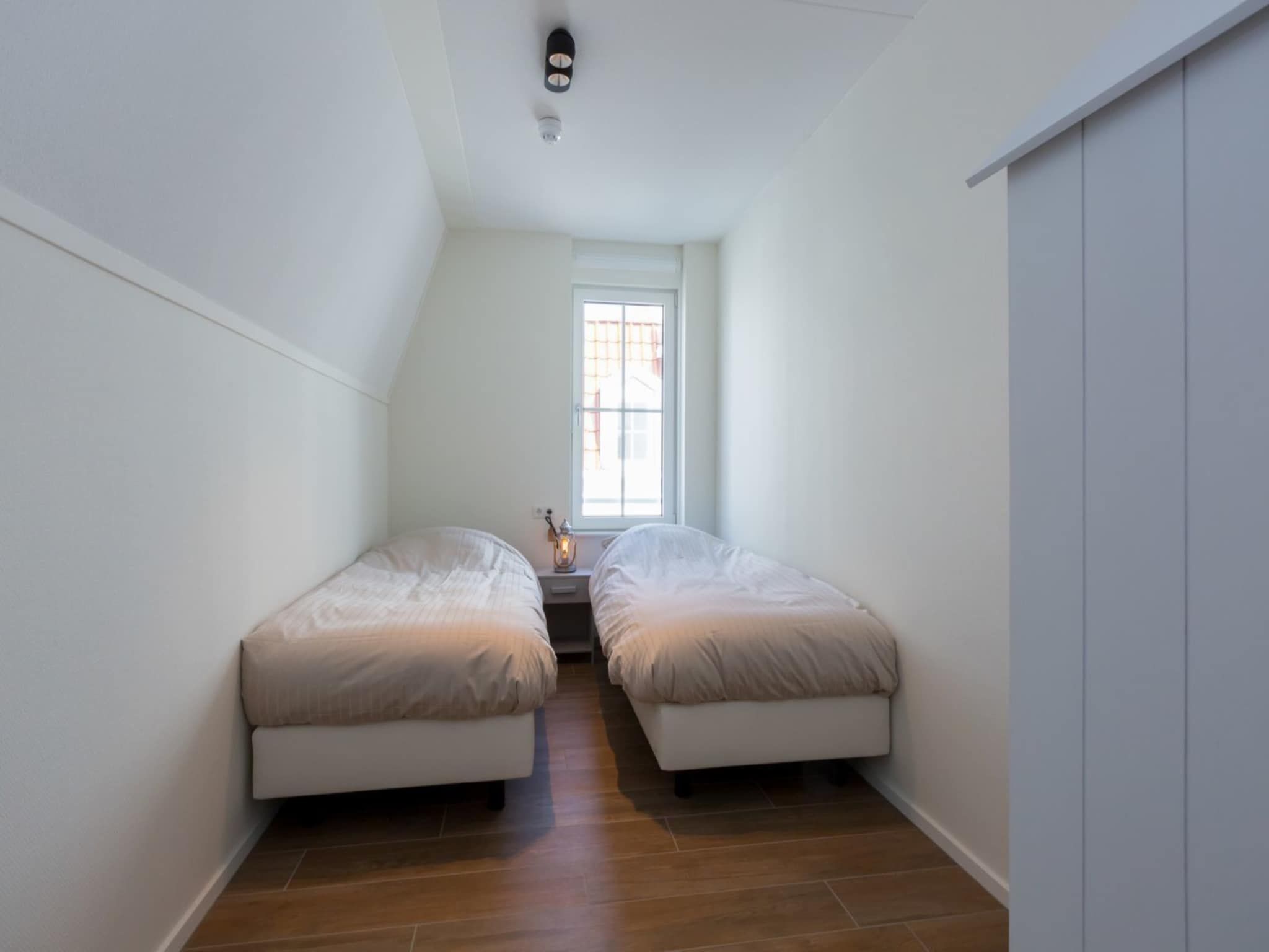 Een slaapkamer van Appartement Duinhof Dishoek 13N - 6 personen in Koudekerke