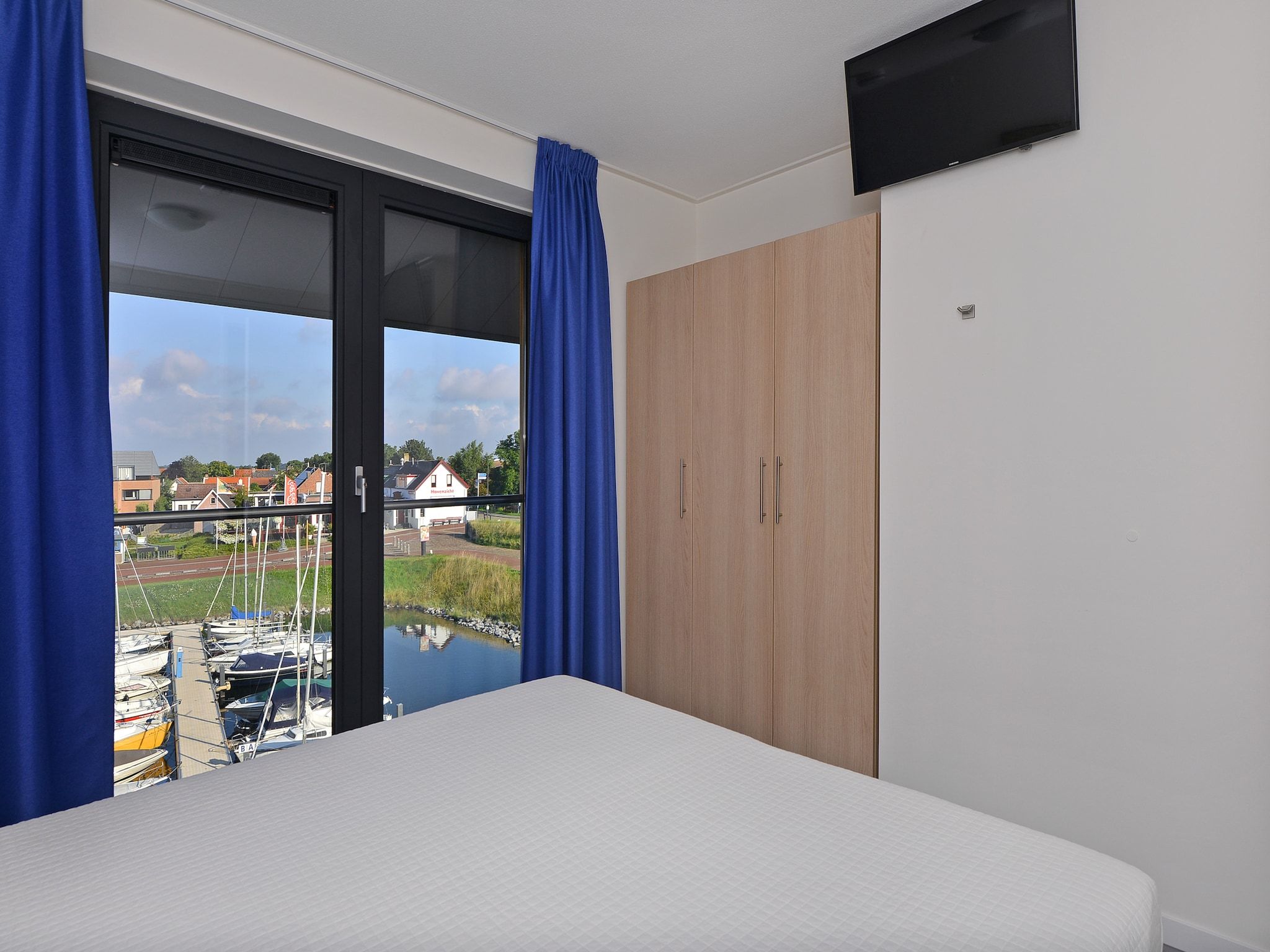 Een slaapkamer van Uithaven 10 F in Kamperland
