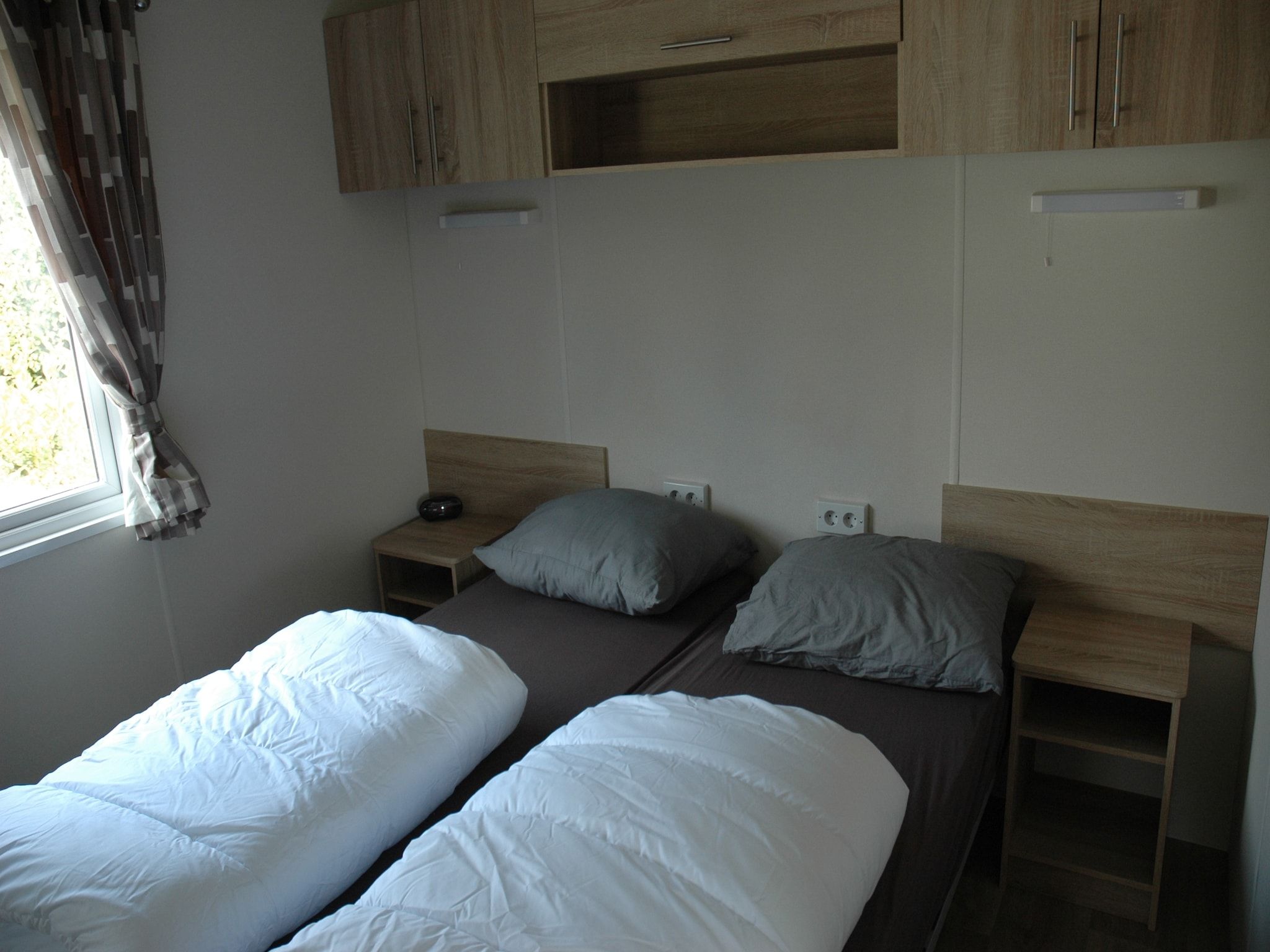Een slaapkamer van Recreatiepark Duinhoeve 9 in Udenhout