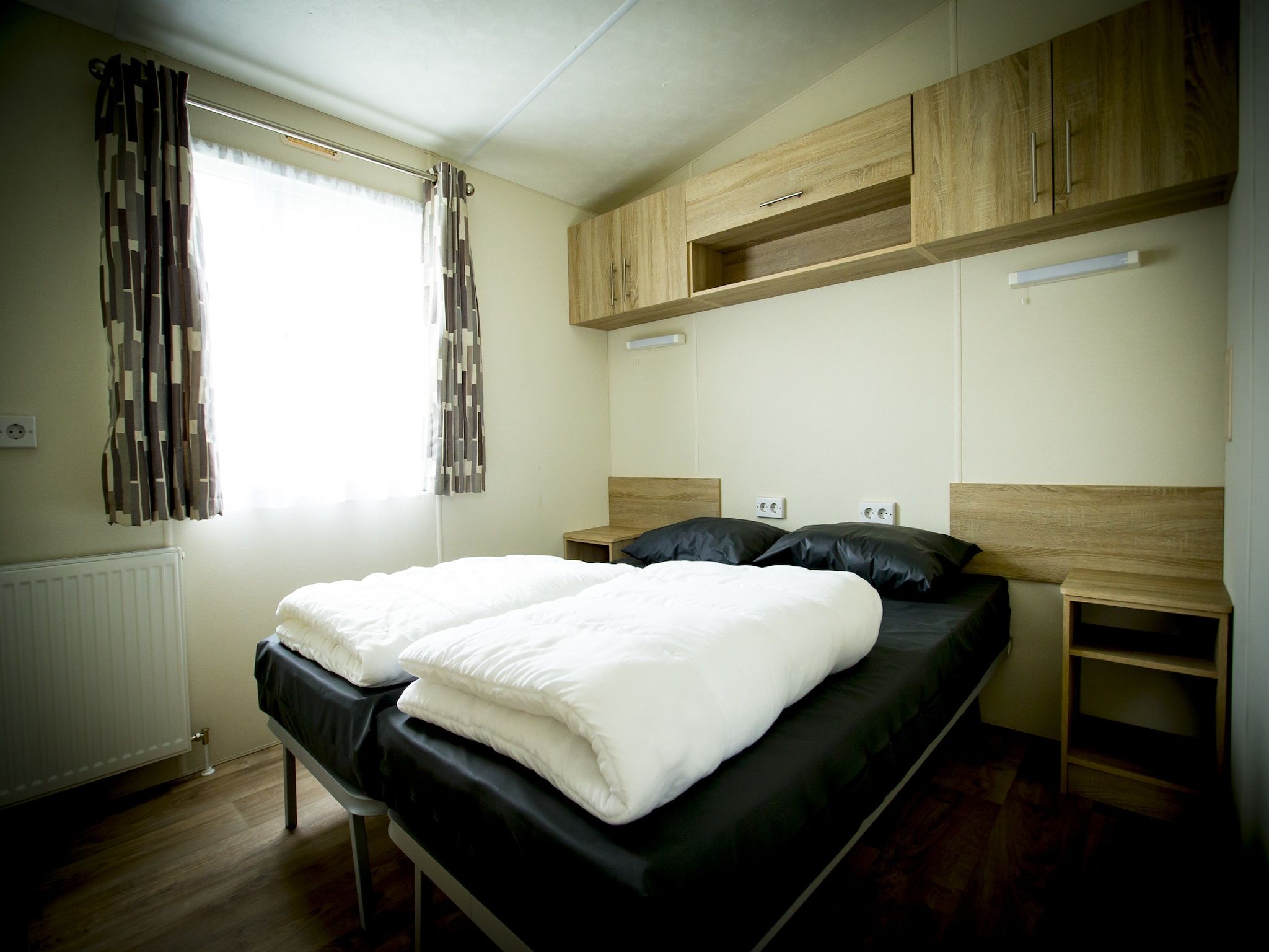Een slaapkamer van Recreatiepark Duinhoeve 9 in Udenhout