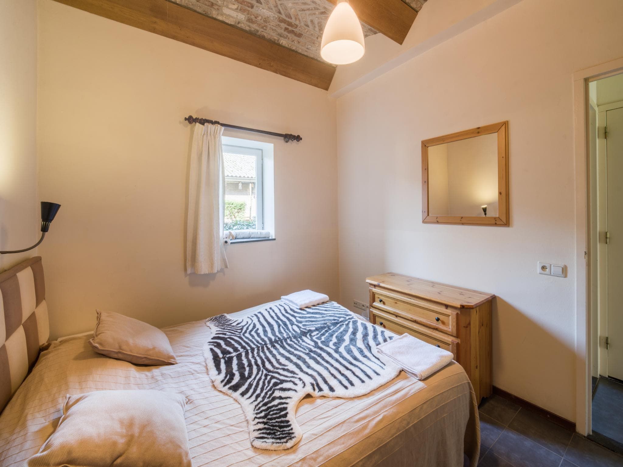 Een slaapkamer van Meschermolen 7 in Mesch-Eijsden