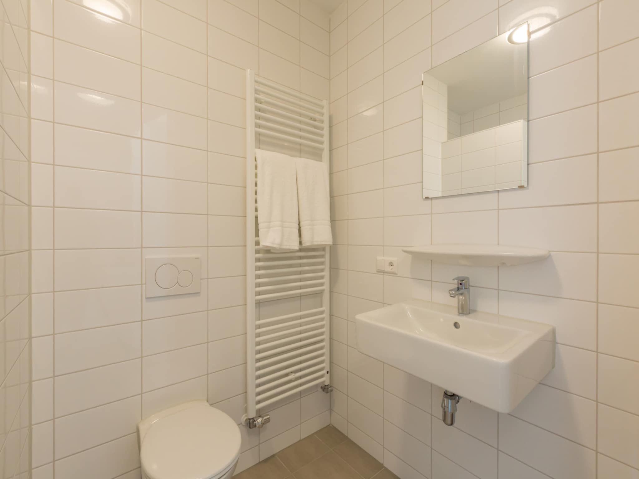 De badkamer van Aparthotel Zoutelande - 6 pers luxe appartement in Zoutelande