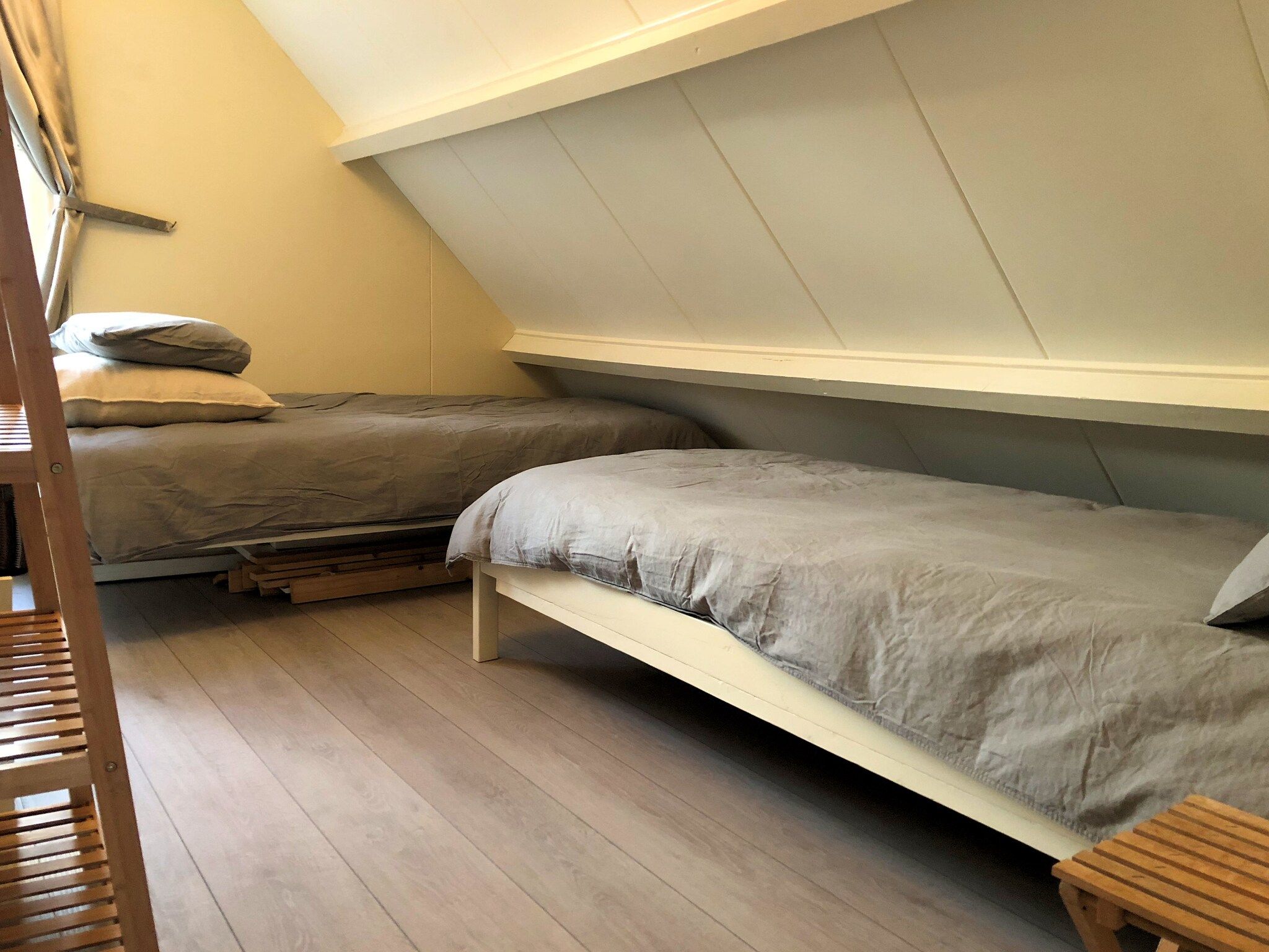 Een slaapkamer van June's Cabin in Noordwijkerhout