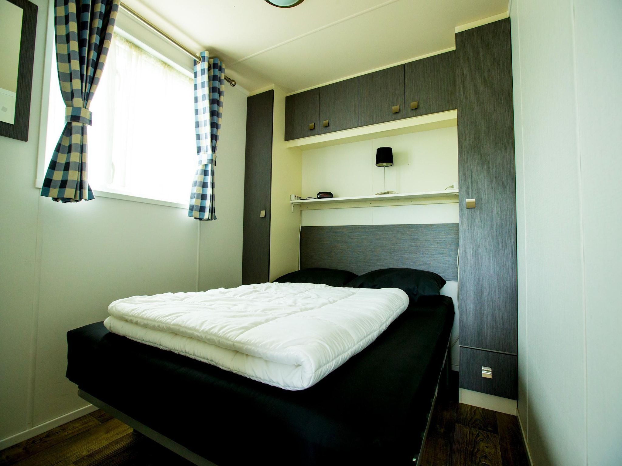 Een slaapkamer van Recreatiepark Duinhoeve 10 in Udenhout