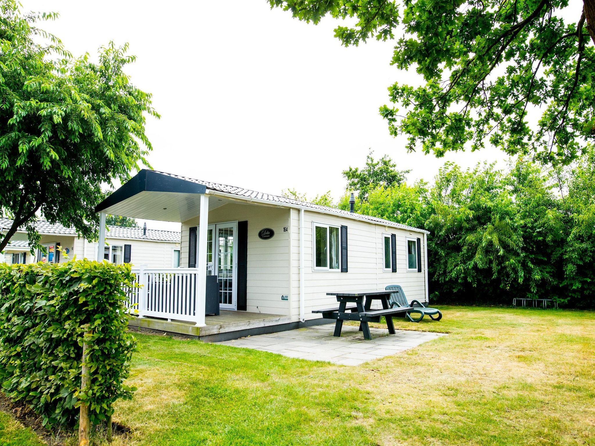 De tuin van Recreatiepark Duinhoeve 11 in Udenhout