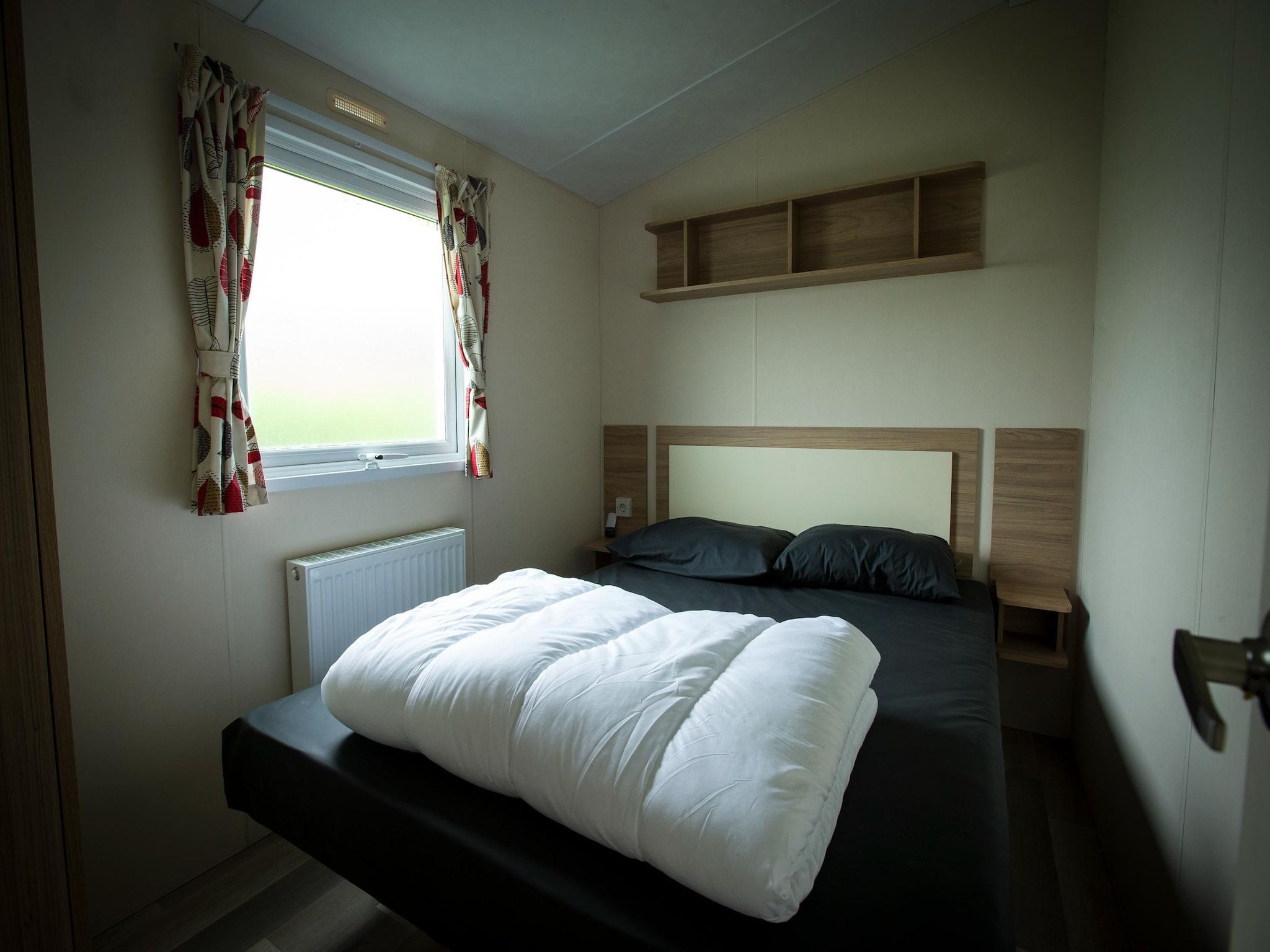 Een slaapkamer van Recreatiepark Duinhoeve 12 in Udenhout