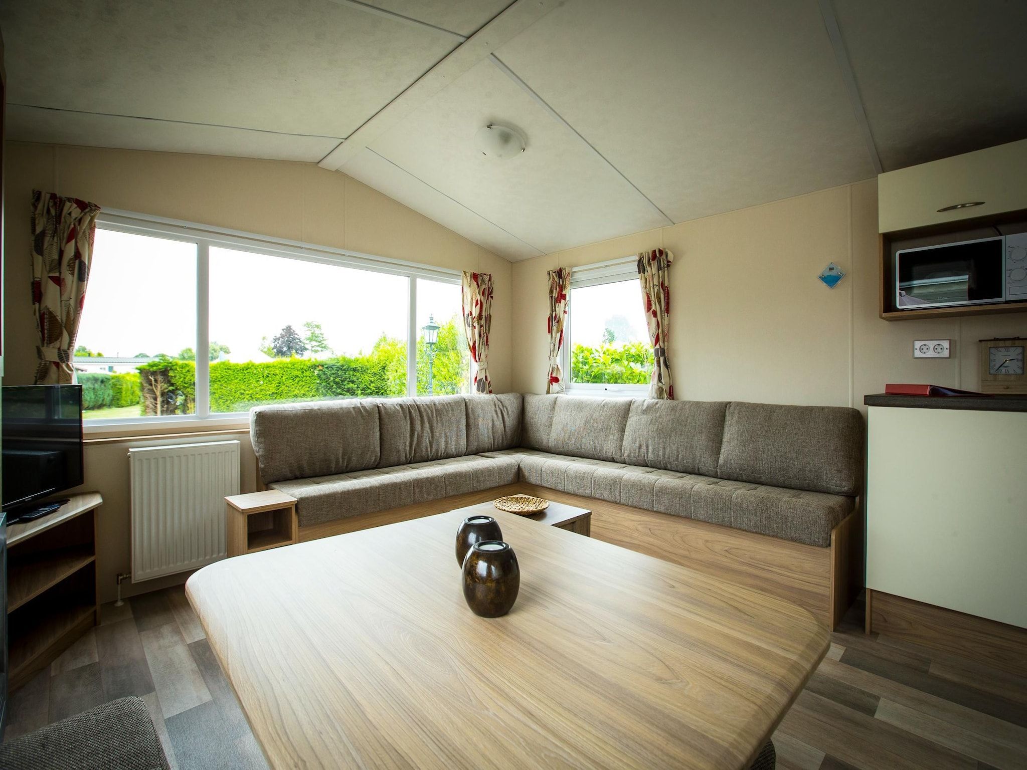 De woonkamer van Recreatiepark Duinhoeve 12 in Udenhout
