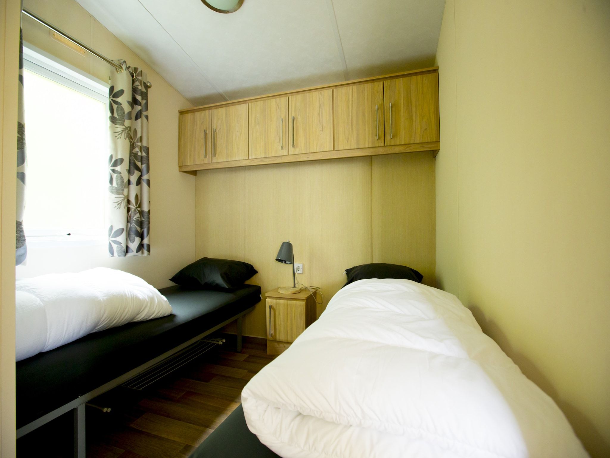Een slaapkamer van Recreatiepark Duinhoeve 13 in Udenhout