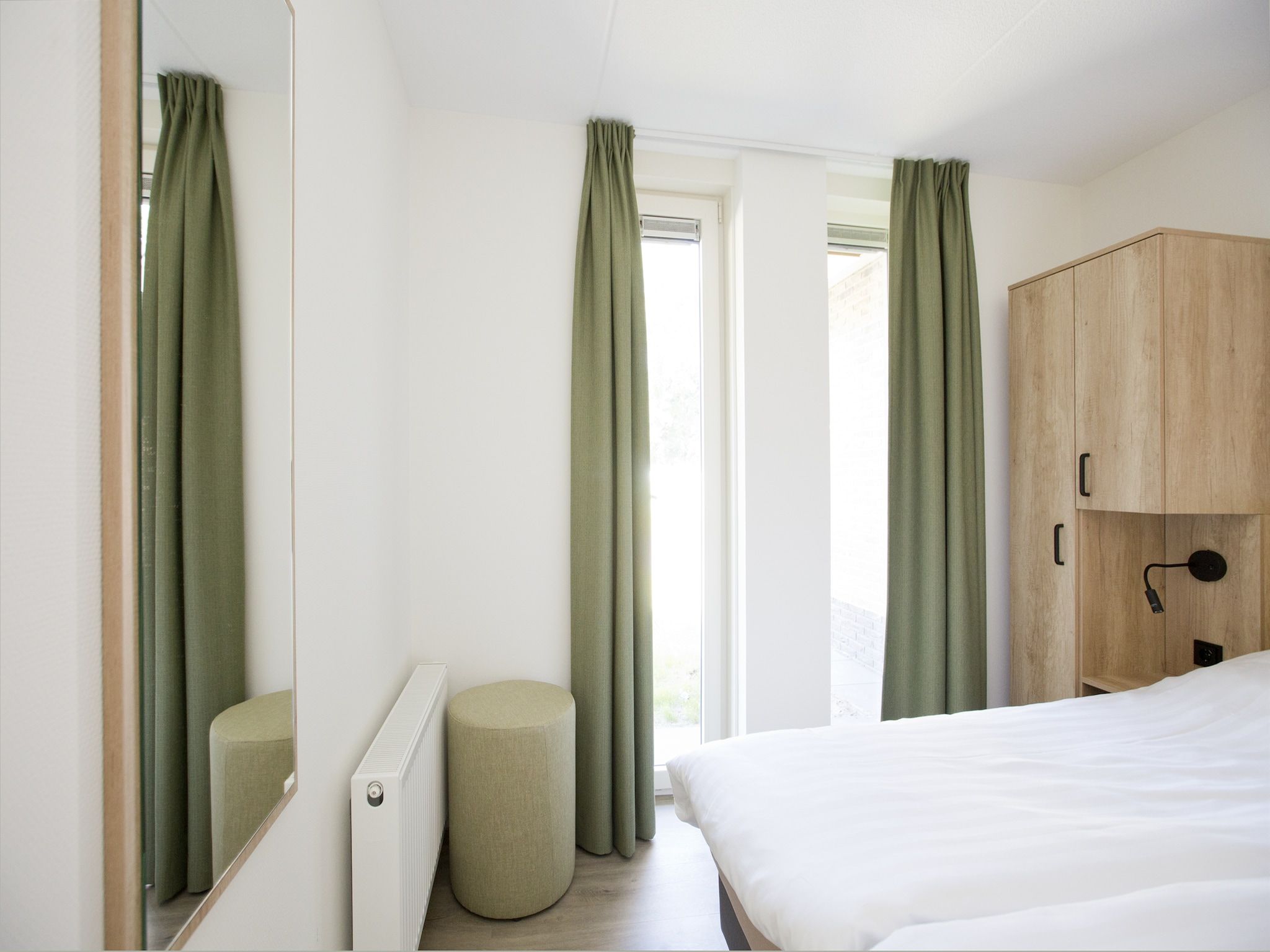 Een slaapkamer van Landgoed De IJsvogel 6 in Voorthuizen
