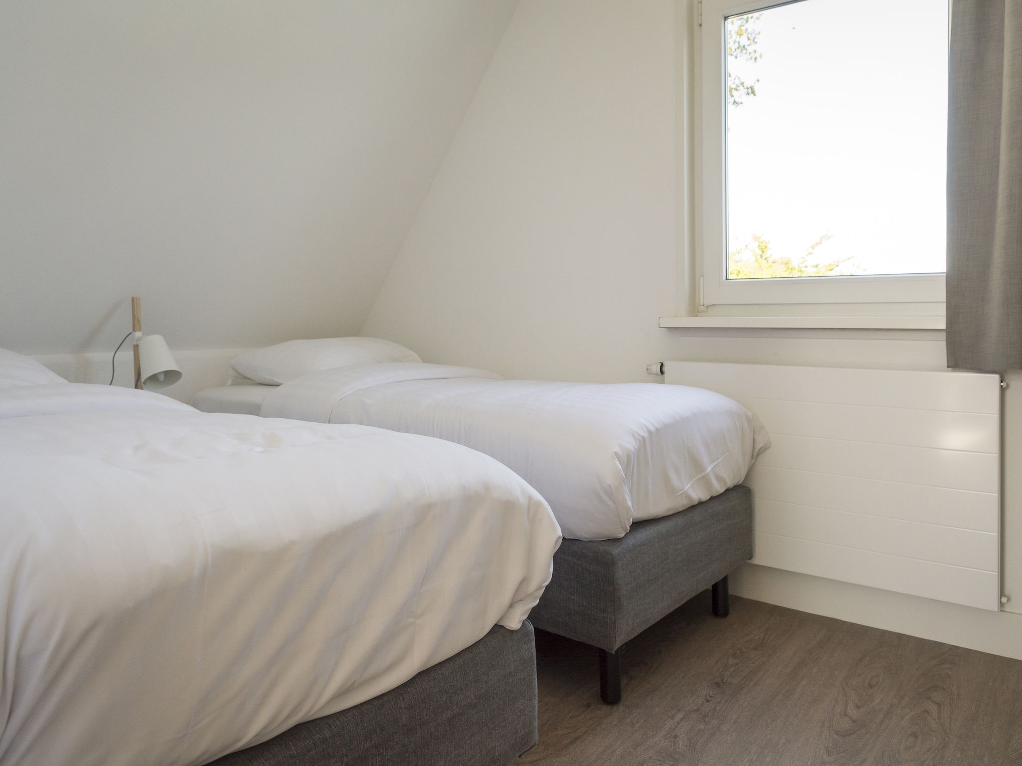 Een slaapkamer van Bouwlust E9 in De Cocksdorp Texel