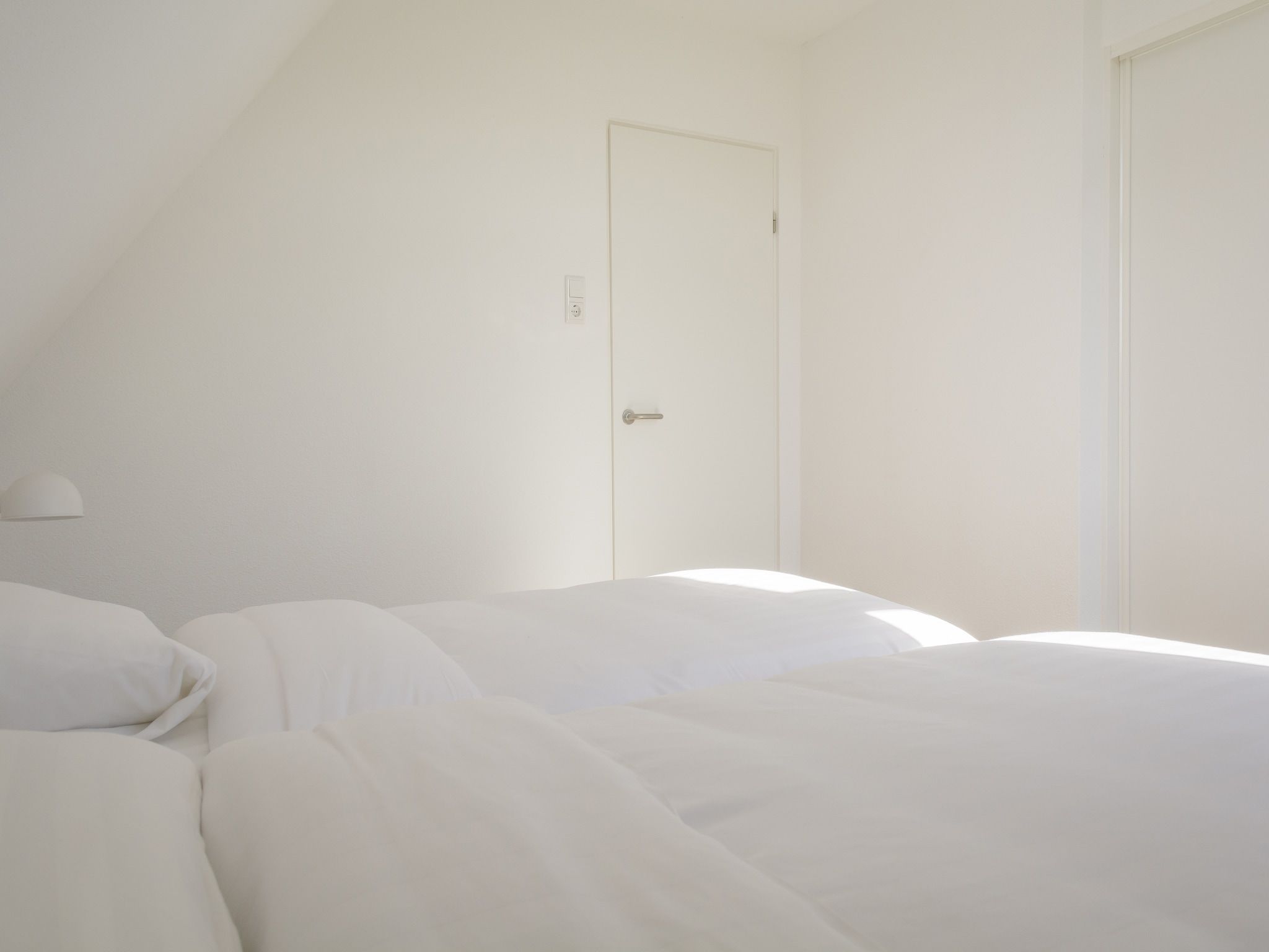 Een slaapkamer van Bouwlust E9 in De Cocksdorp Texel