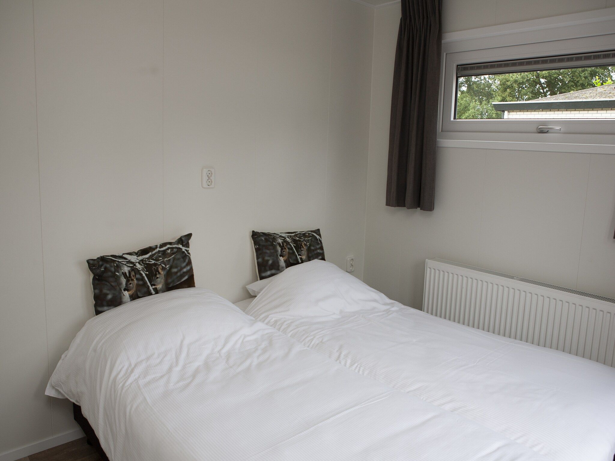 Een slaapkamer van Recreatiepark de Boshoek 21 in Voorthuizen