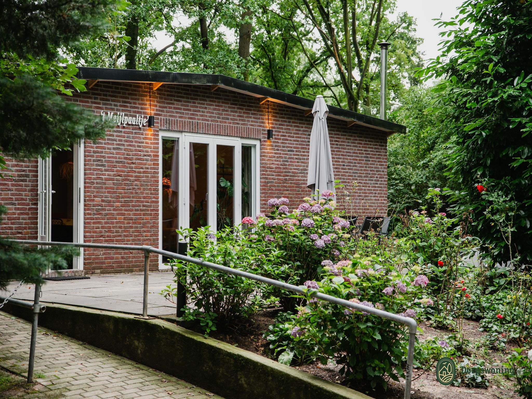 De buitenkant van Dorpswoning In het Bos in Leende