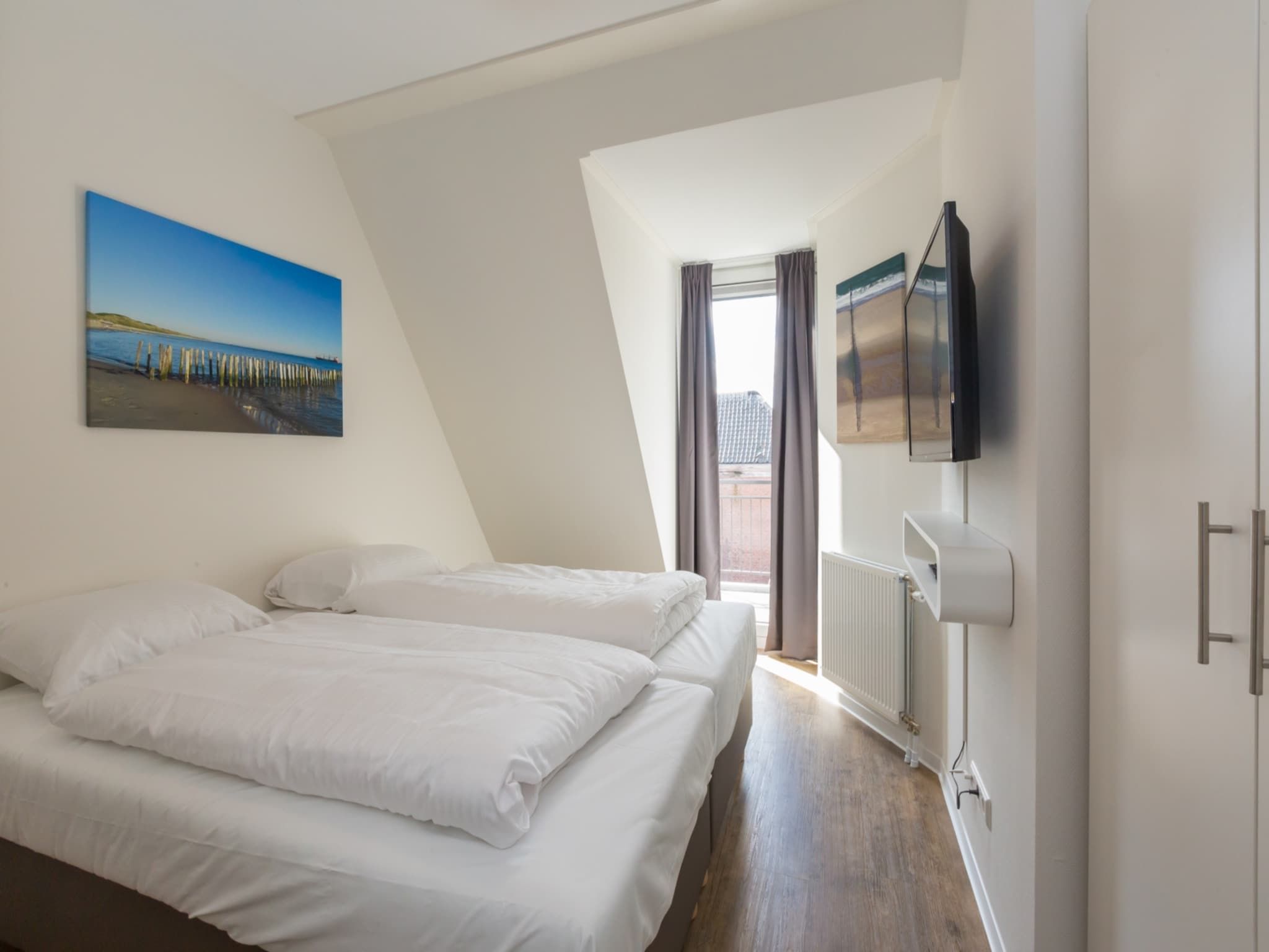 Een slaapkamer van Aparthotel Zoutelande - 5 pers luxe appartement in Zoutelande